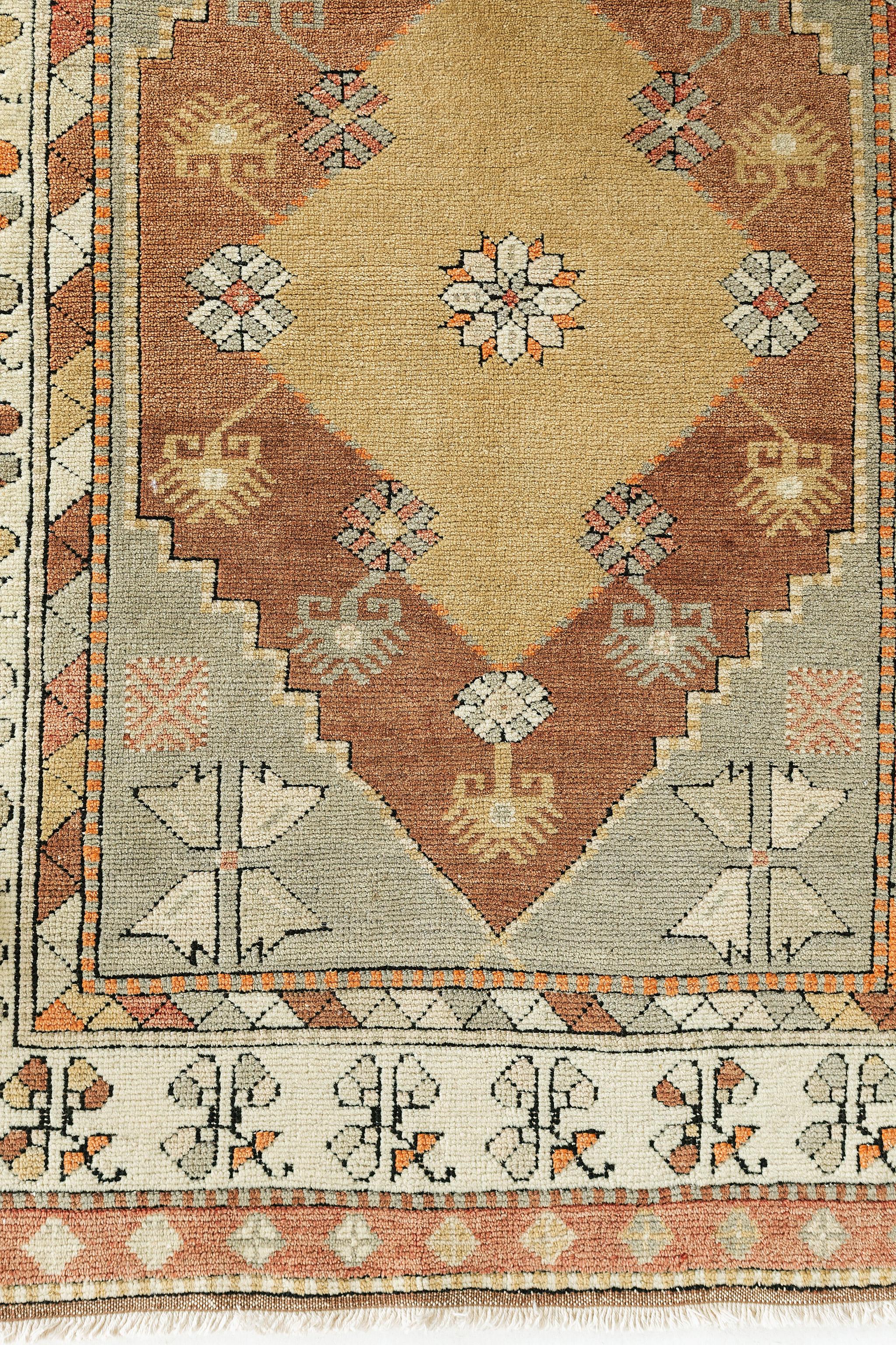 A vintage Turkish Anatolian rug with a charming and rich feel. Anatolian rugs weave together dyes and colours, motifs, textures and techniques that are popular in Anatolia or Asia Minor. Such techniques include their symmetrical and geometric design
