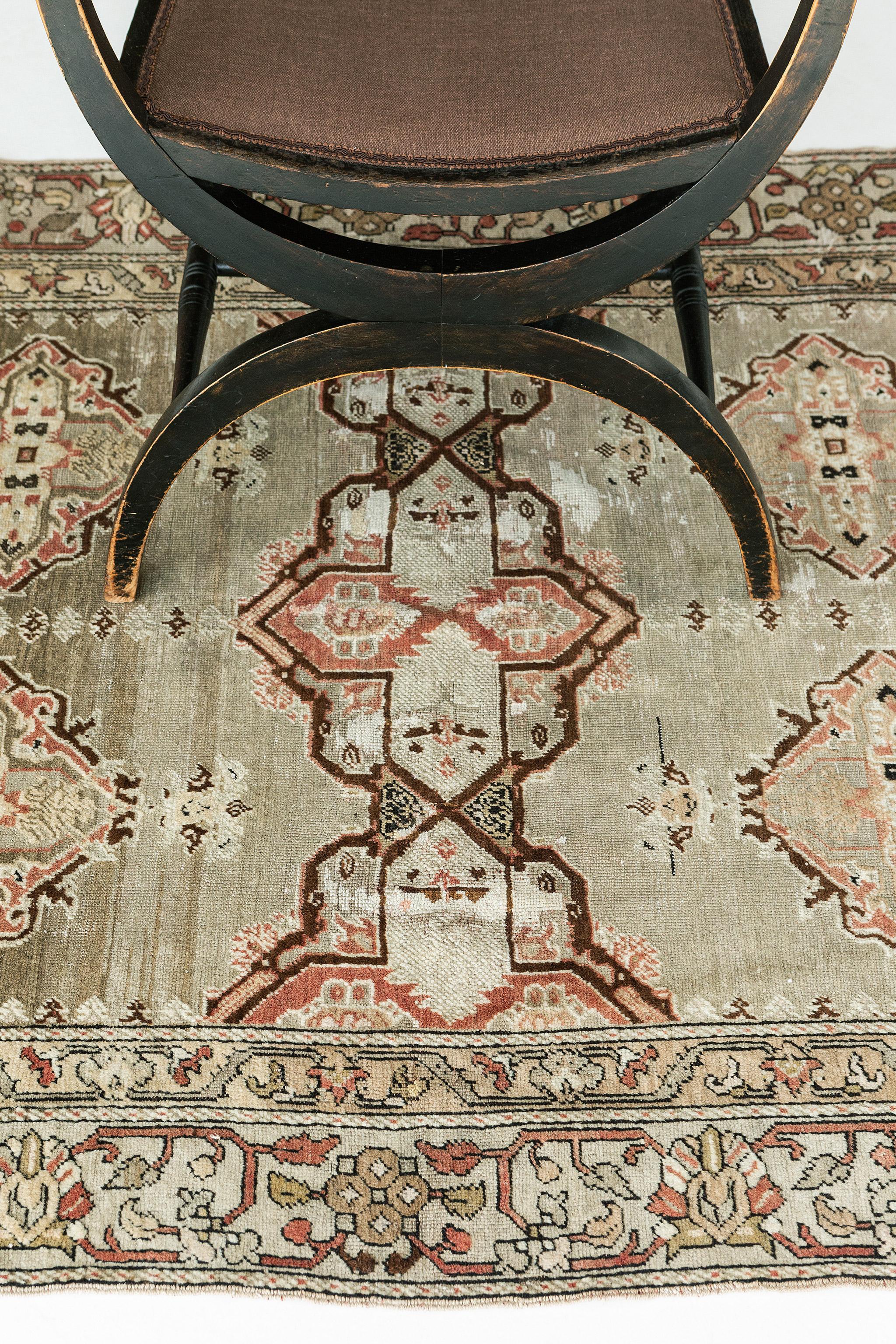 Soft elegance and warm pastel colors bring coordination to this Vintage Turkish Anatolian rug. It embodies lavish Anatolian style with an all-over ornate pattern composed of palmettes and rosettes dancing between a subtle latticework trellis. A