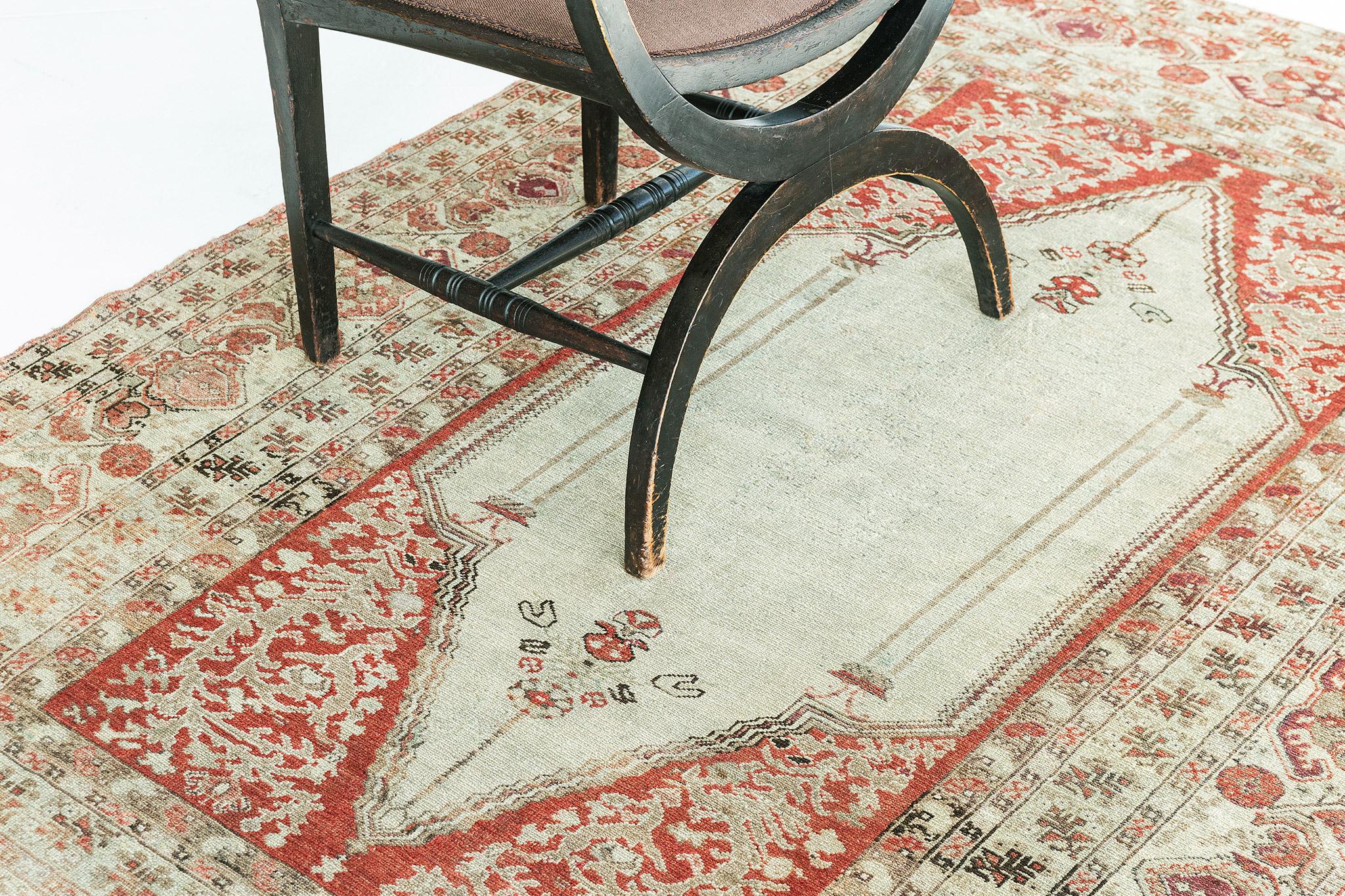 With a graceful all-over botanical pattern and striking appeal, this impressive Vintage Turkish Anatolian Rug can beautifully blend contemporary, modern, and traditional interiors. It features ornate elements of blooming palmettes and stylized