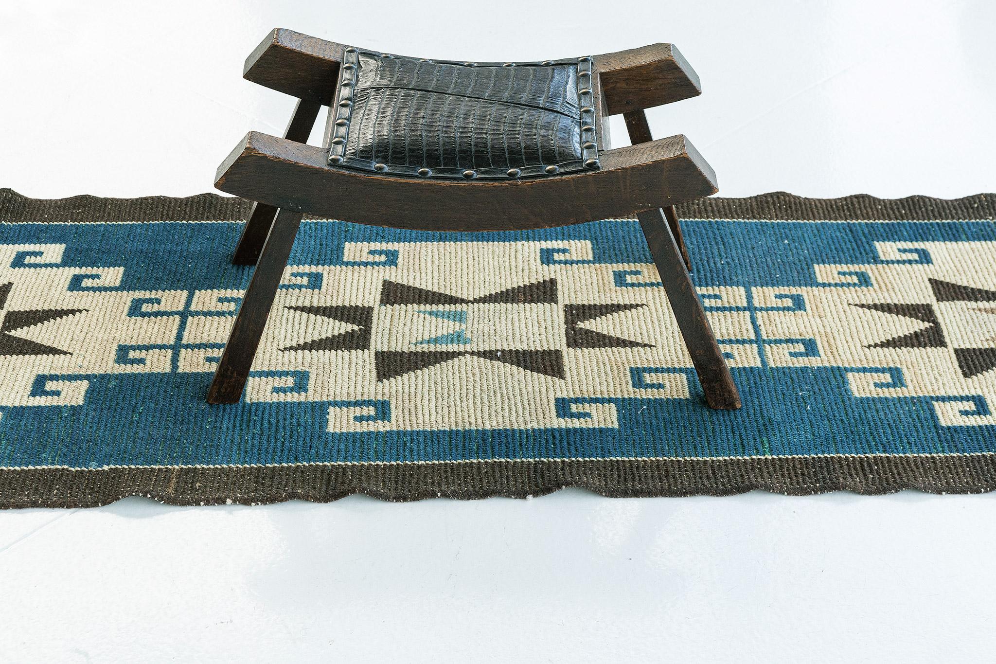 Cool earth-tones with turquoise hues combined with elements of symbolical essence collide in this vintage Turkish Anatolian rug. Running the length of this mesmerizing rug are three large-scale star used to express happiness and fertility. It is