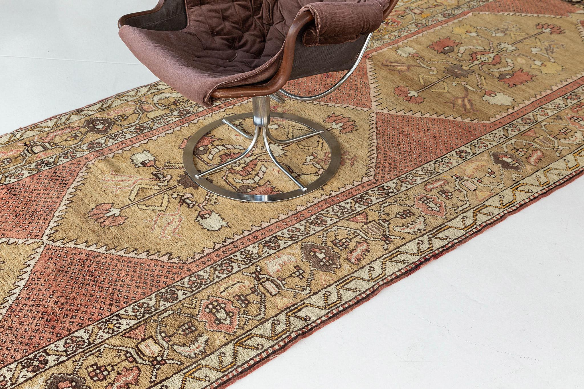 This Vintage Turkish Anatolian Runner features three distinctive lozenge cusped botanical medallions composed of palmettes, blossoms, stylized florals, leafy tendrils and thin angular vines dancing rhythmically. A stylized botanical meander border