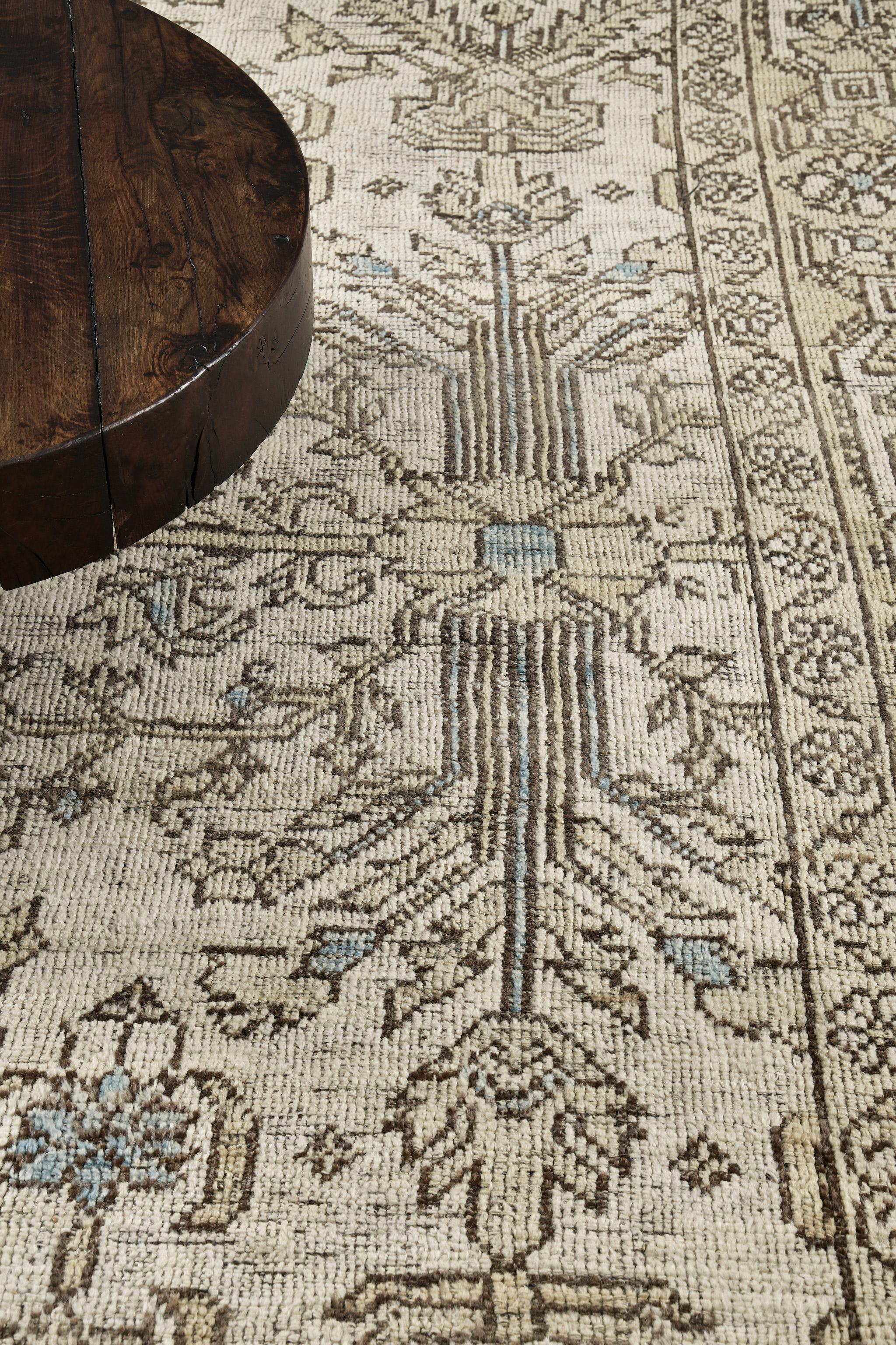 Captivating vines and florid embellishments are expressed through gold accents to a blooming and fascinating beige field. The borders are beautifully woven that were created intricately to form an elegant Zigler Revival Rug. Truly a creative