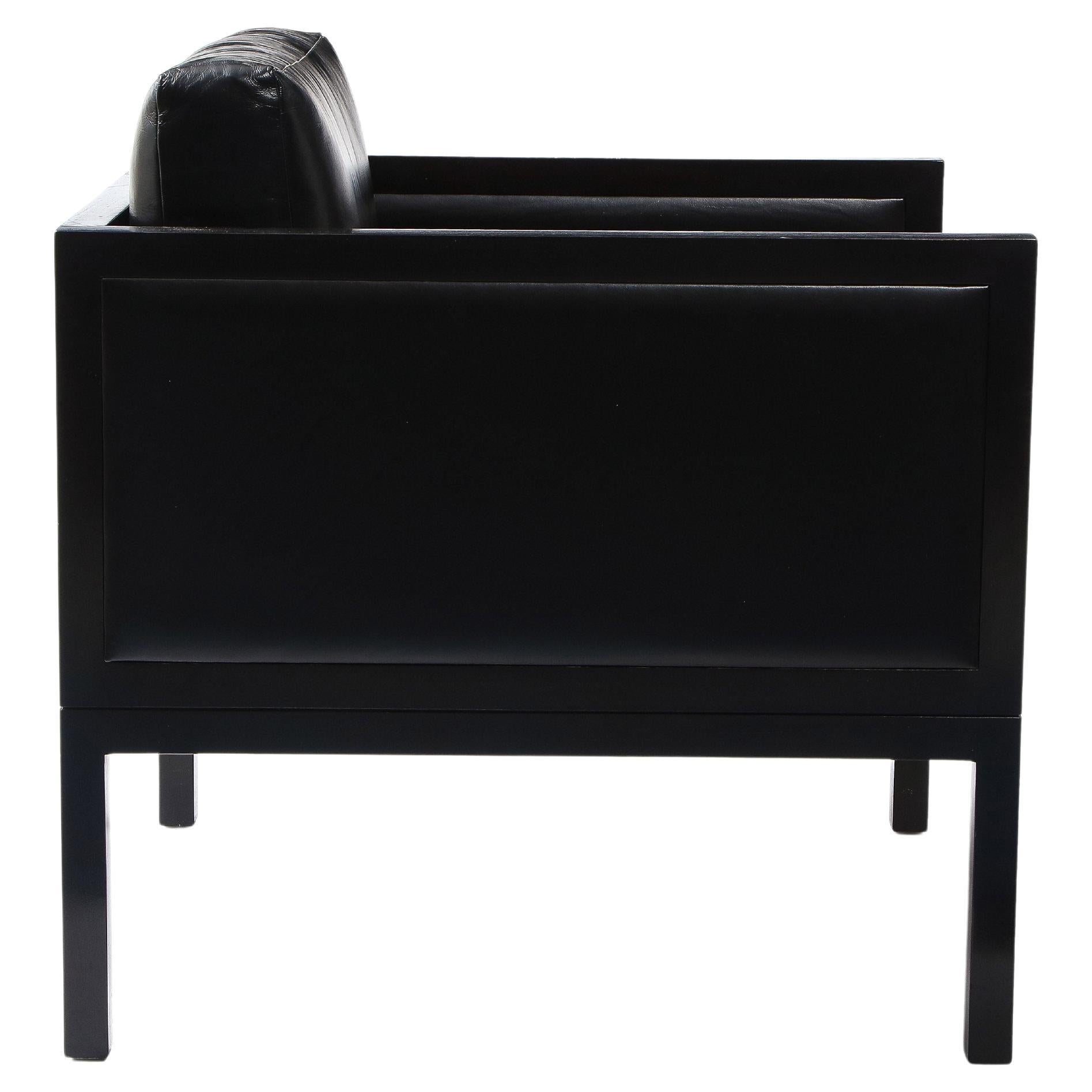 A piece from MEIER/FERRER, the furniture collaboration of Ana Meier and Charlie Ferrer.

This strict form is quite comfortable, suitable for lounging. Tonal black palette of leather, wood and metal.