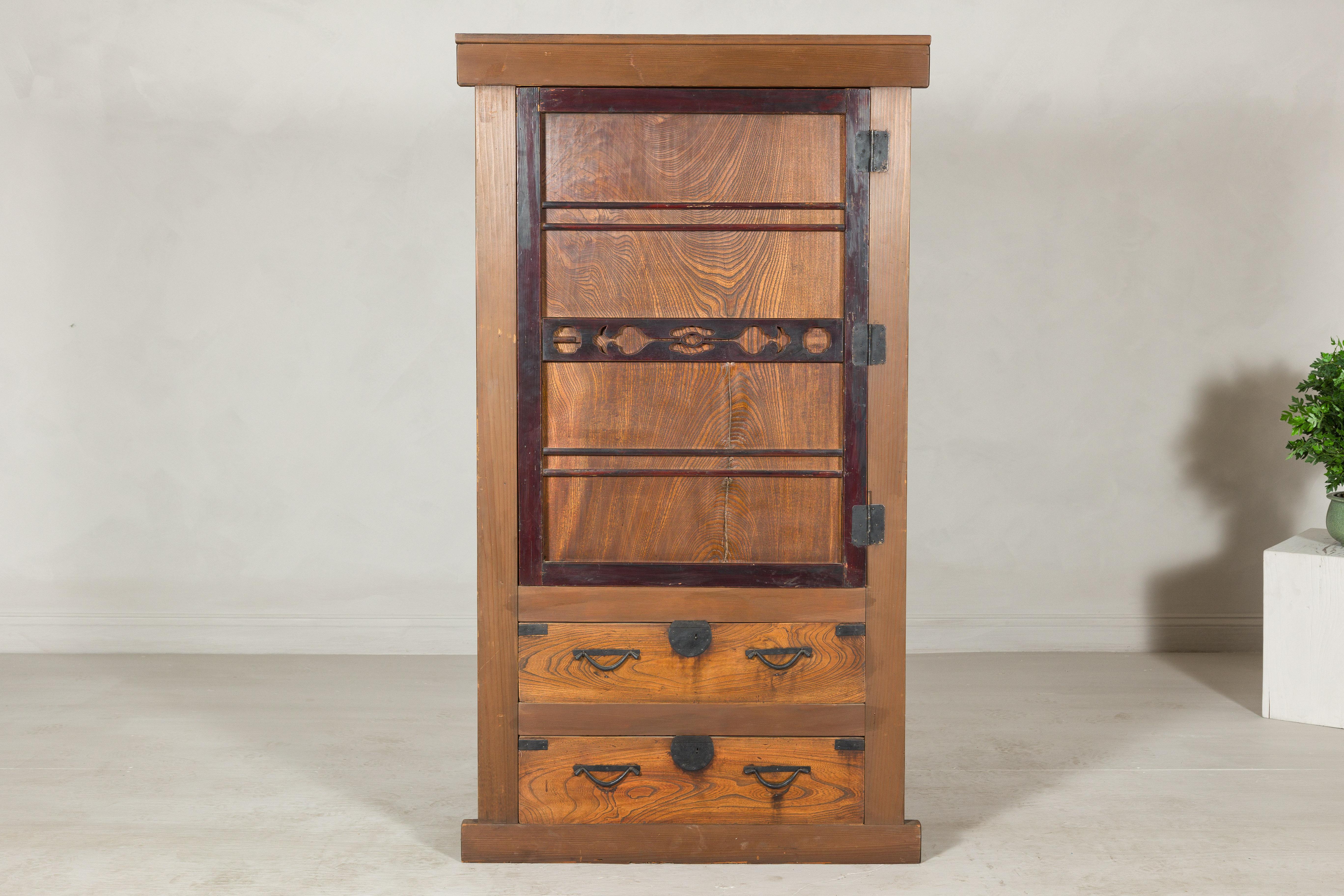 A refined piece of Meiji-era craftsmanship, this antique Mizuya-dansu (kitchen chest) dates to circa 1900 and reflects the understated elegance of traditional Japanese interiors. Crafted from solid cedar and elm, its warm patina showcases expressive