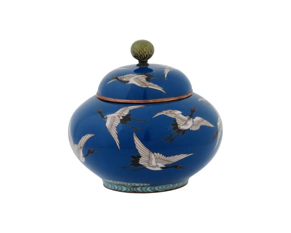An antique Japanese Cloisonne Enamel lidded jar . Late Meiji period, Circa 1895 Rounded shape with pronounced base. Blue ground color. The piece is decorated with a crane bird motif.
Globe finial on top of the lid. a work of Hayashi Kodenji, 1831 to