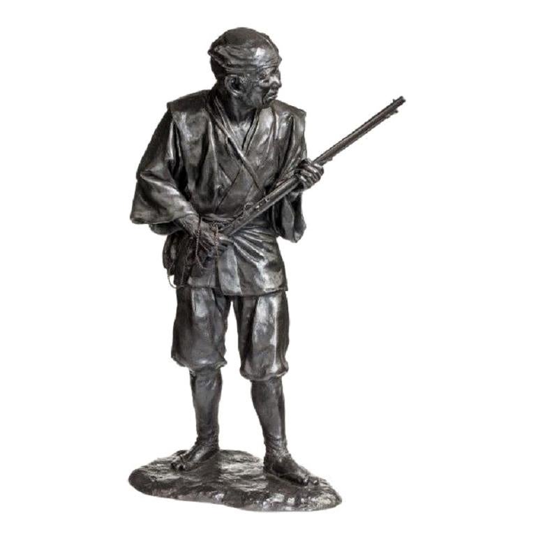 Meiji Period Bronze of a Huntsman Carrying a Gun For Sale