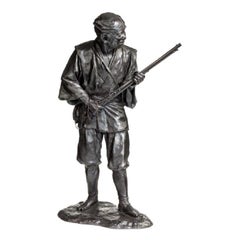 Antique Meiji Period Bronze of a Huntsman Carrying a Gun