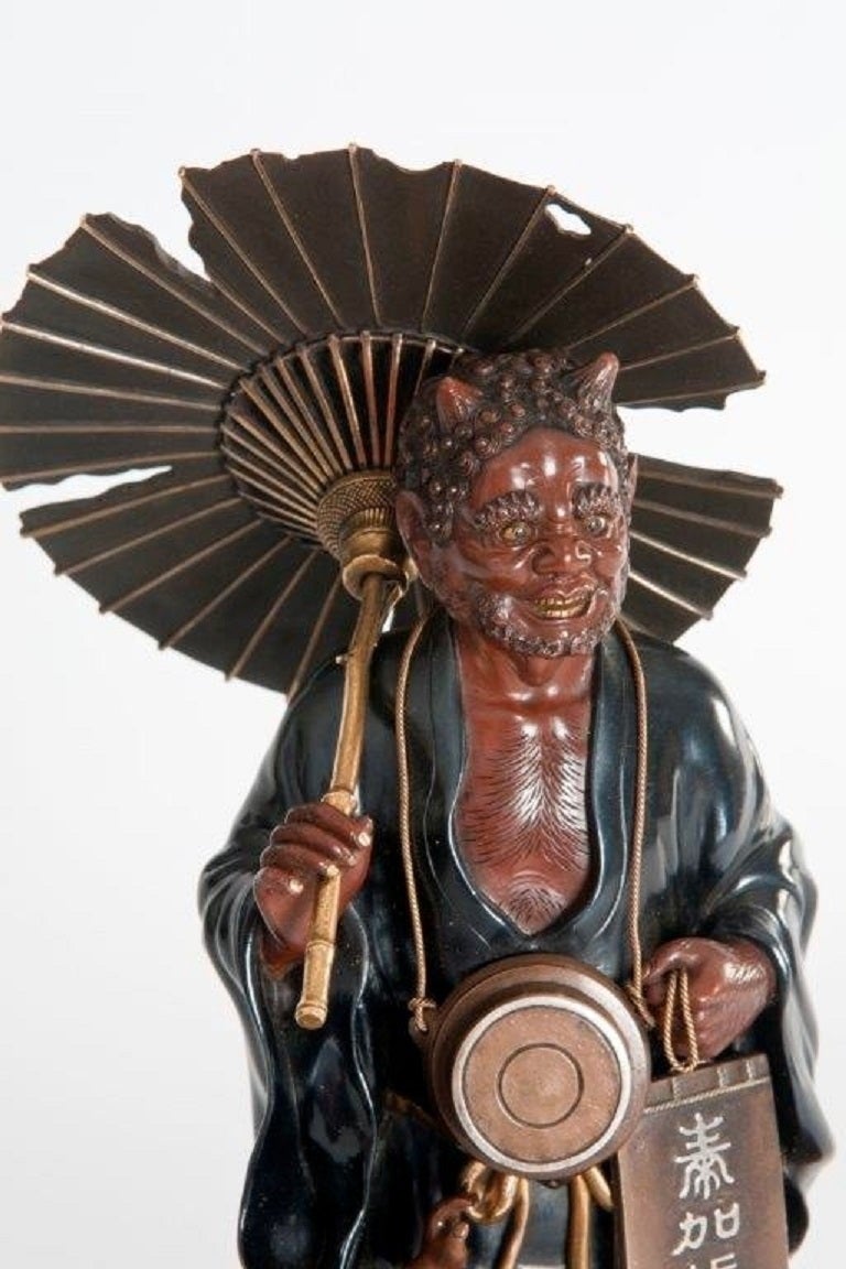 Japanese Meiji Period Bronze of an Oni Holding a Parasol For Sale