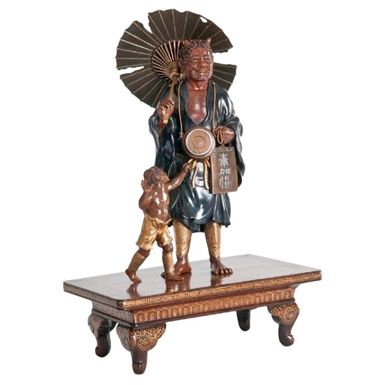 Meiji Period Bronze of an Oni Holding a Parasol For Sale