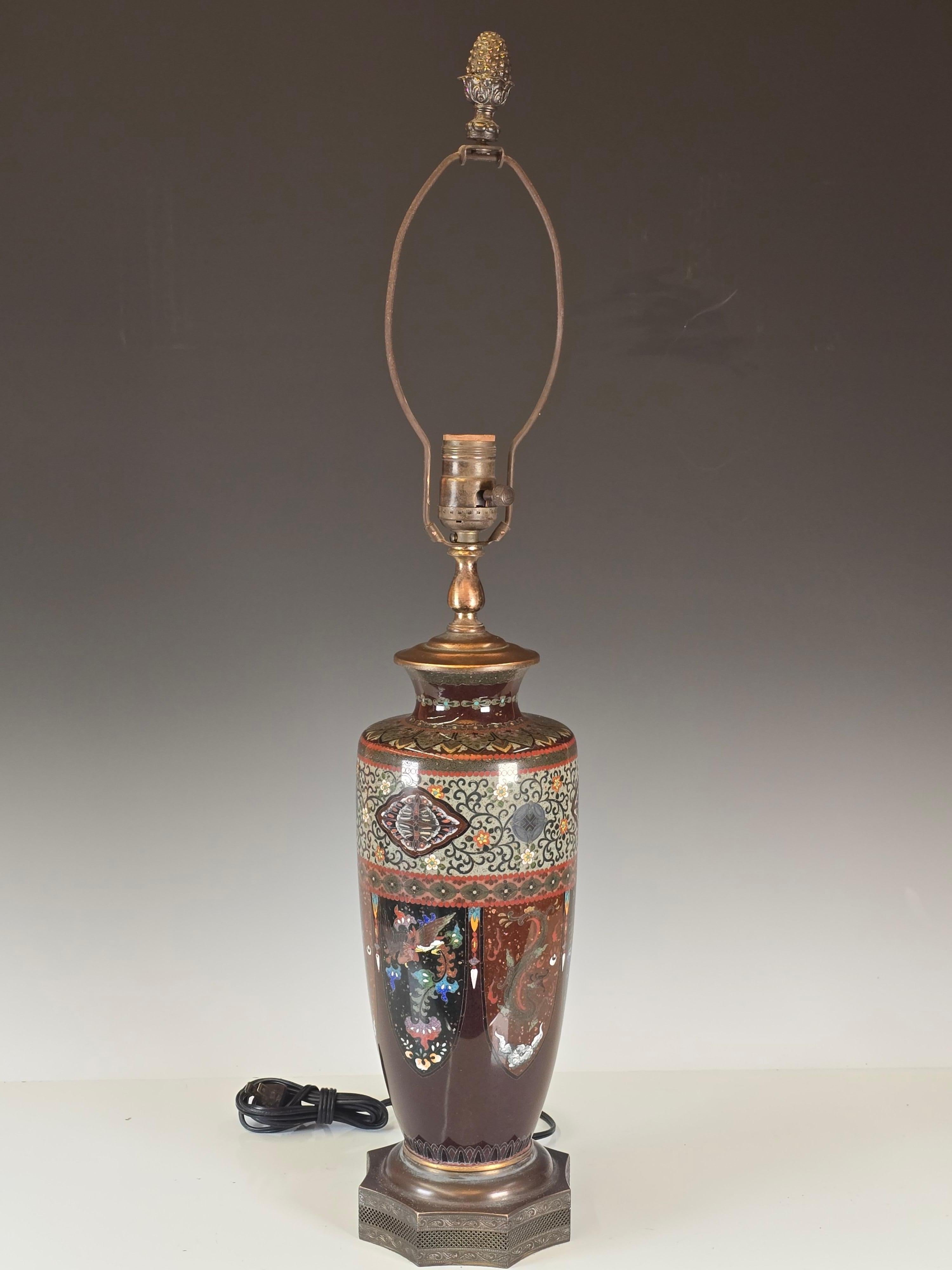 A beautiful finely done Meiji period cloissoné table lamp on a custom made 1920s pierced brass base.   Beautiful done polychrome enameled mythical beasts add a touch of mystique to the lamp.   The vase dates the mid to late 19th Century which was