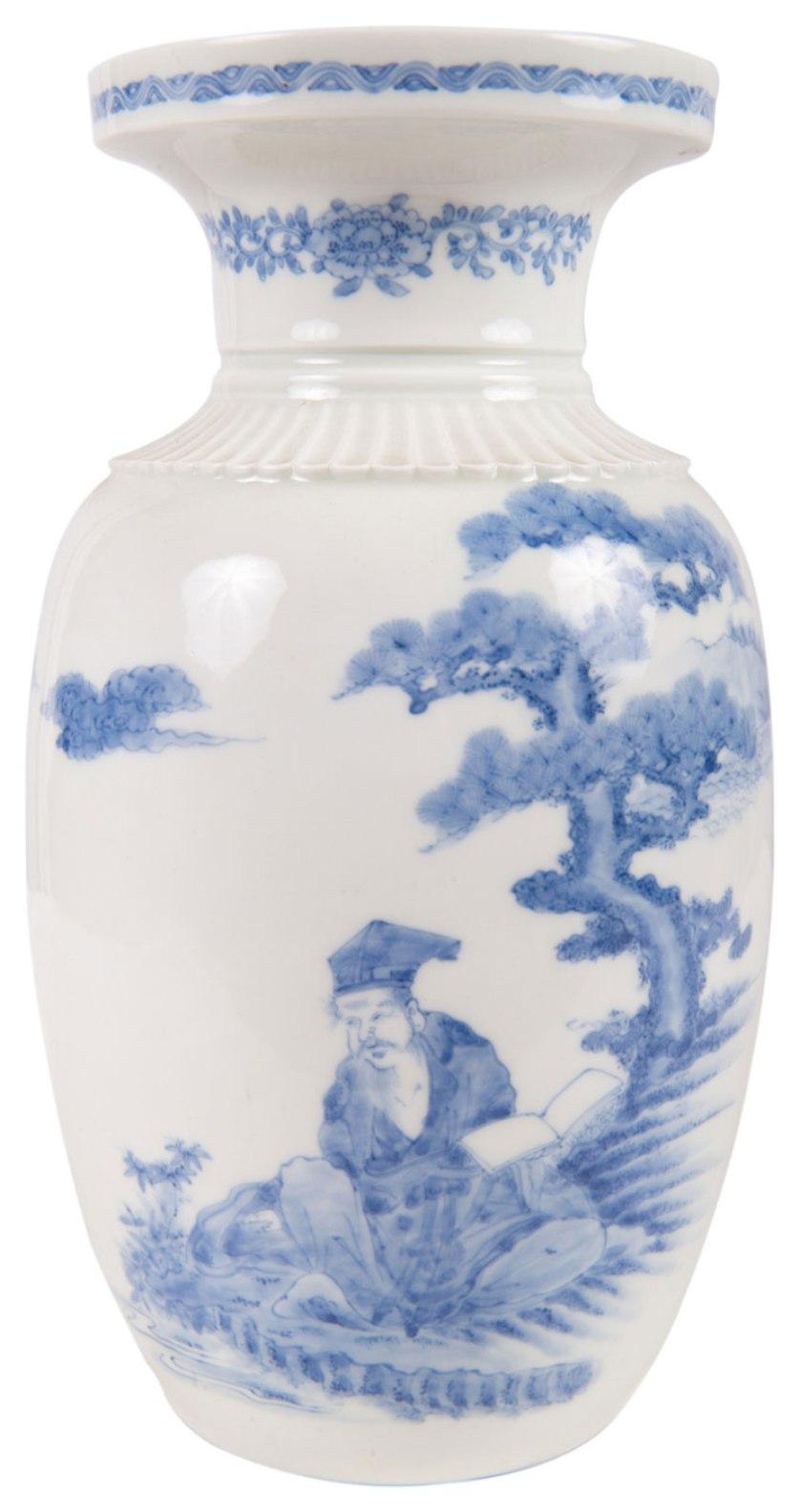 A beautiful late 19th century Meiji period (1868-1912) Hirado blue and white vase. Having classical motif and foliate decoration to the carved neck, with a hand painted scene of a seated scholar beneath and a blossom tree.