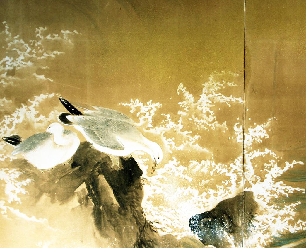 Seagulls in the waves of the sea. Japanese folding screen two panels hand painted on the vegetable paper and golden specks. Meiji period, circa 1900.