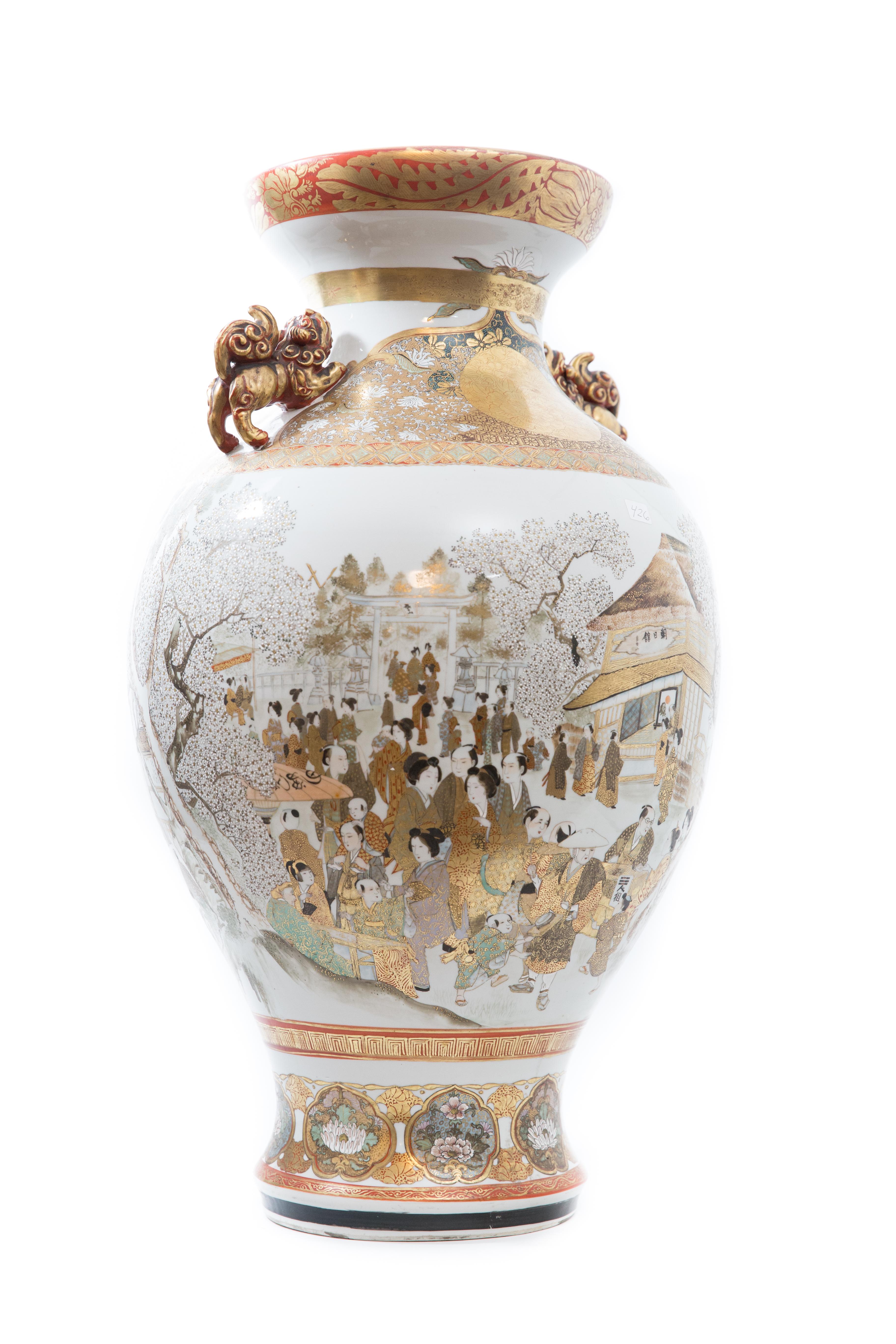 Offered is a Meiji period Japanese Kutani/Satsuma porcelain vase. This vase stands about 30”in height and exhibits exceptionally fine handpainting and enamel techniques. The vase depicts noble processions and the cherry blossum festival activities