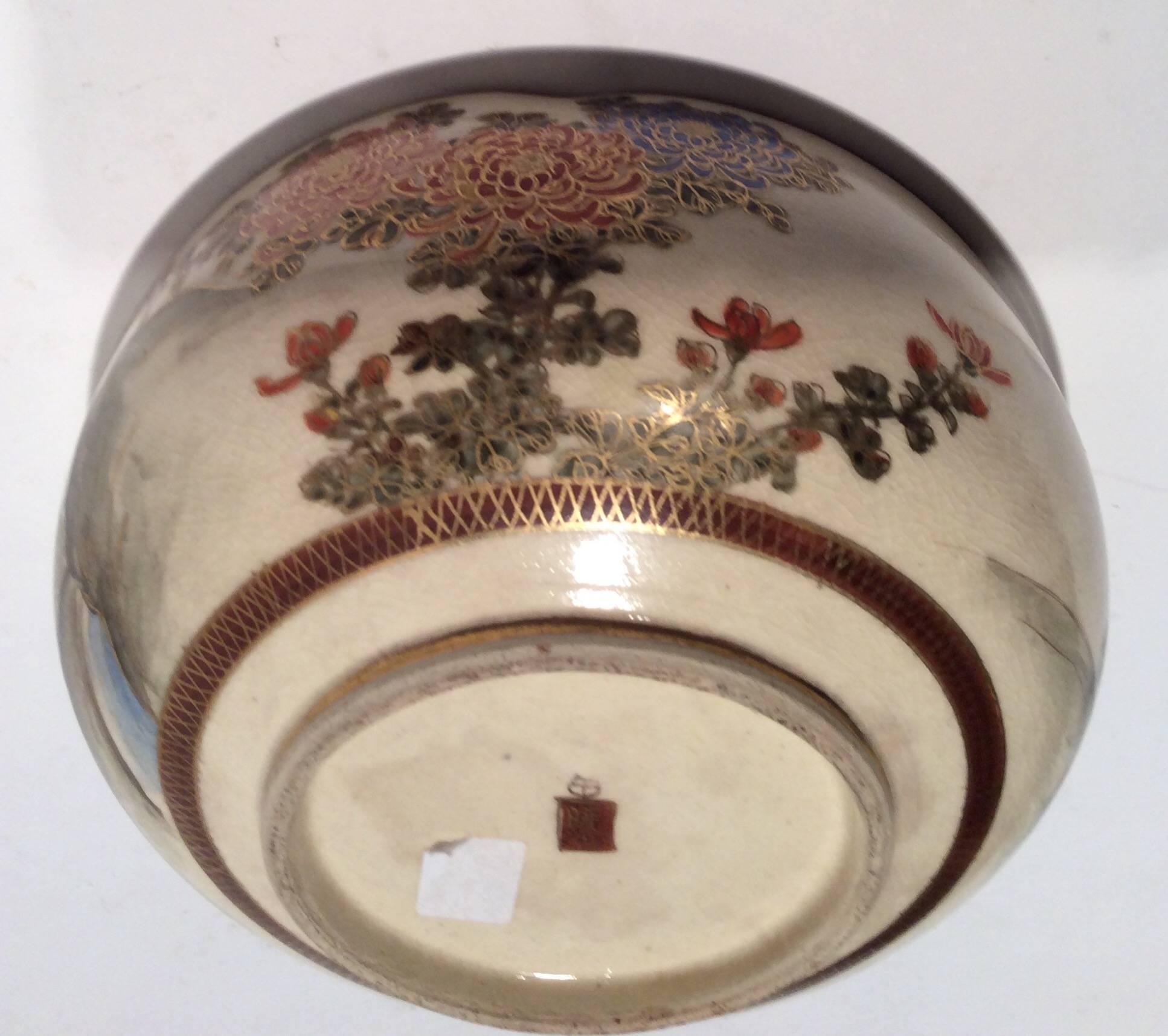 From the estate of an illustrious American General. 
This fine example of Satsuma Porcelain is decorated with draped wisteria over a pictorial scene of a bridge over water and he gentle sloped roofs of classical buildings.
The outer rim is