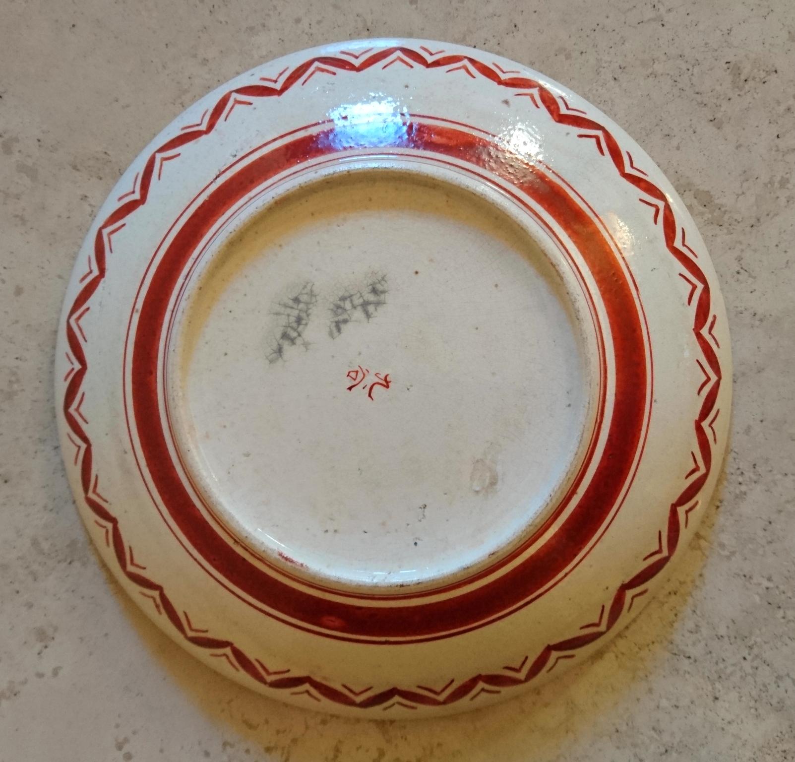 A decorative Japanese porcelain bowl decorated in iron red and gilt, late Meiji period.