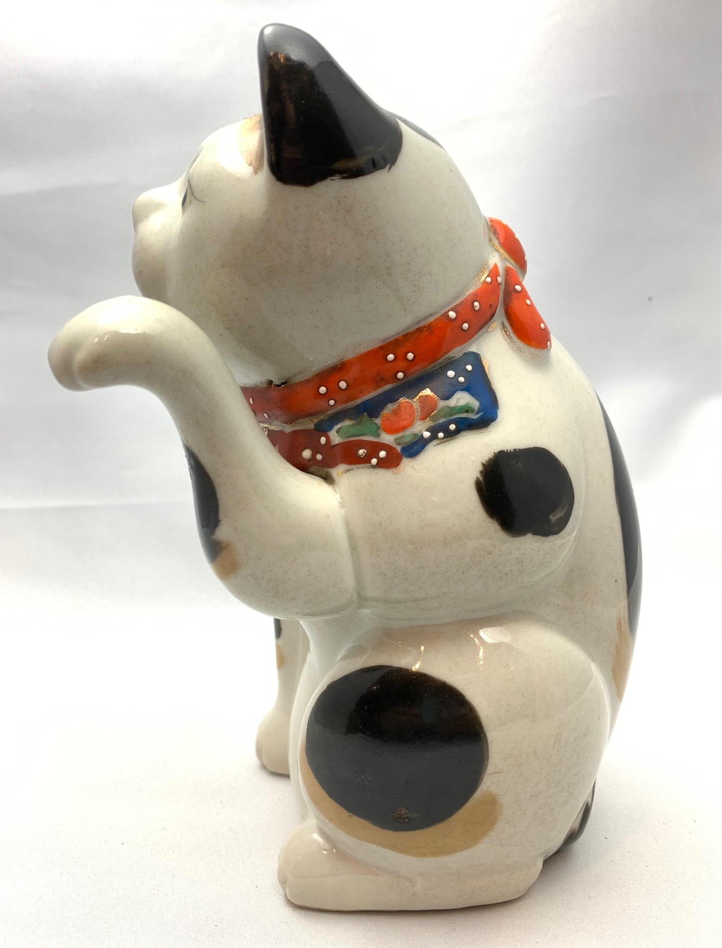 Antique Japanese porcelain maneki-neko, or 