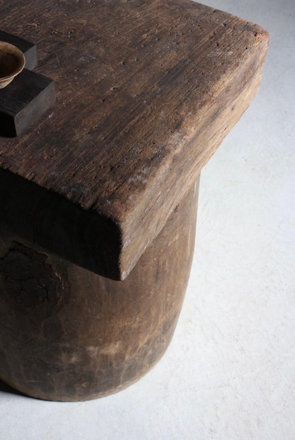 This rare rice grinder table comes in two pieces; top and the body. It was carved from solid organic wood with its natural wound and texture which is unachievable using standard stains. Could be used both separately and together, as in either way