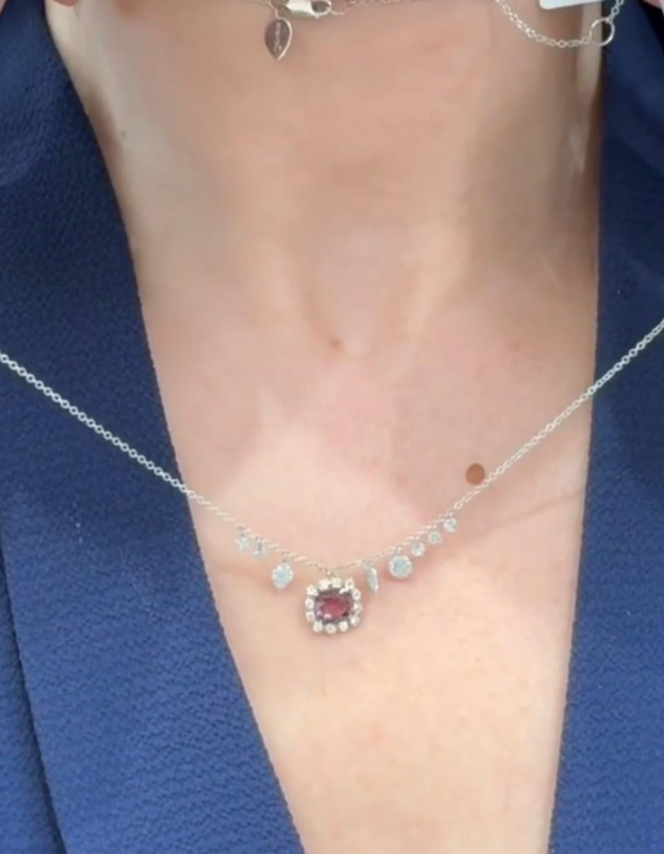 Meira T. 14K two tone gold pendant necklace with diamonds weighing 0.76 carat total.   In the center, one cushion shaped pink tourmaline.  

Necklace can be worn 16, 17, or 18 inches. 

Video and pictures are included here; we are happy to provide