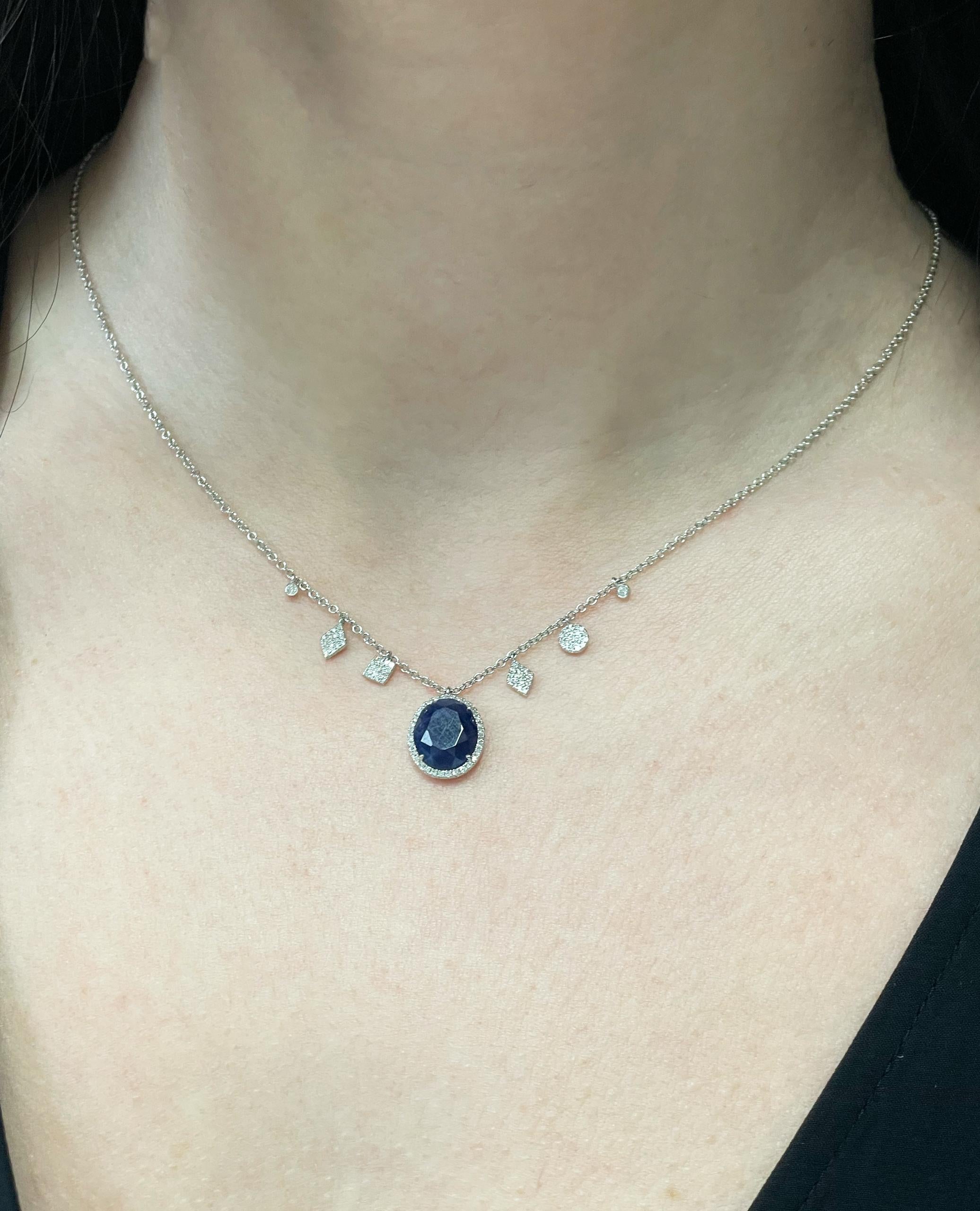 Meira T. 14K white gold pendant necklace with diamonds weighing 0.23 carat total. In the center, one blue sapphire weighing 2.60 carats.  

- Necklace can be worn 16, 17, or 18 inches. 