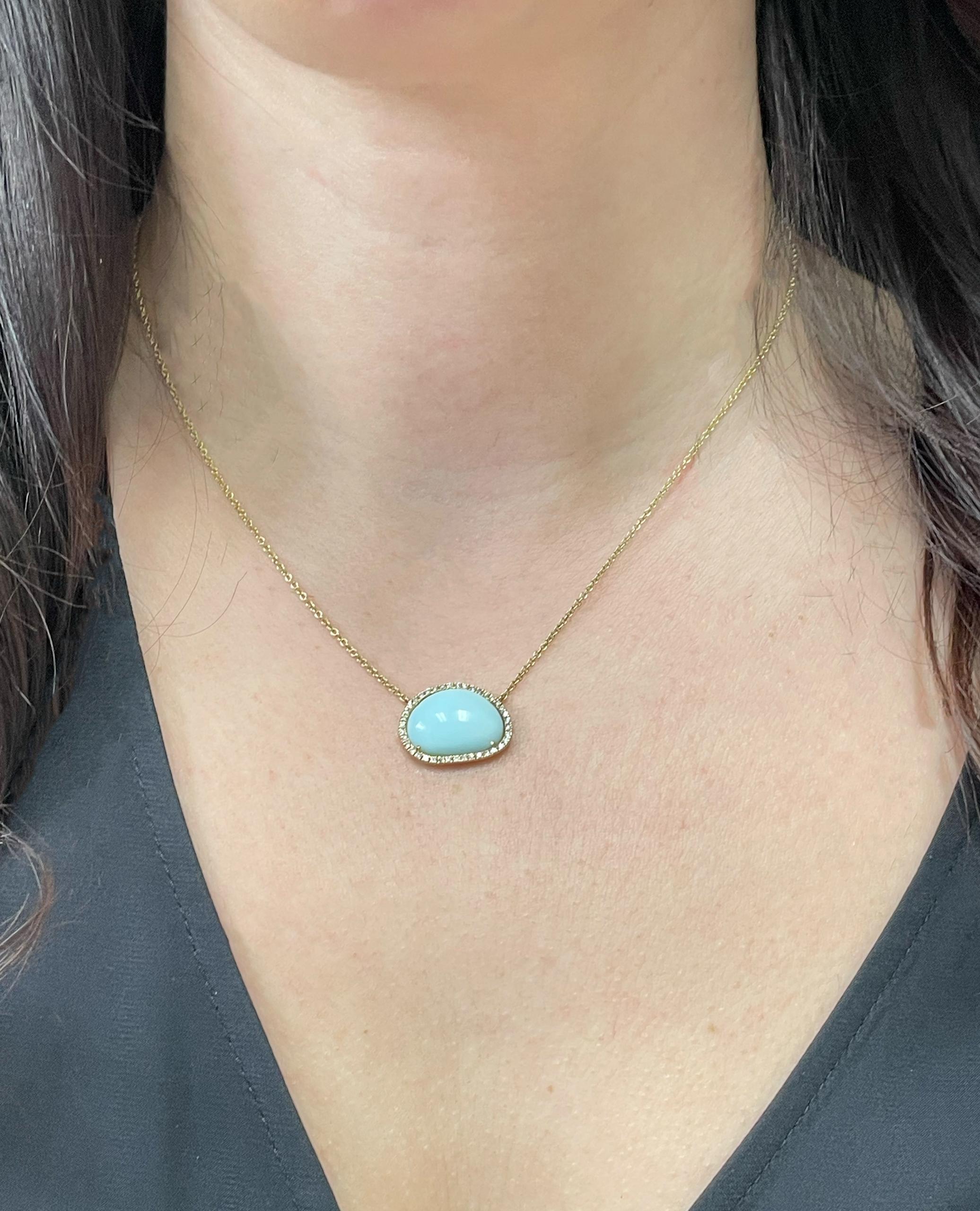 Meira T. 14K yellow gold blue opal pendant necklace with diamonds weighing 0.25 carat total.  

- Necklace can be worn 16, 17, or 18 inches. 