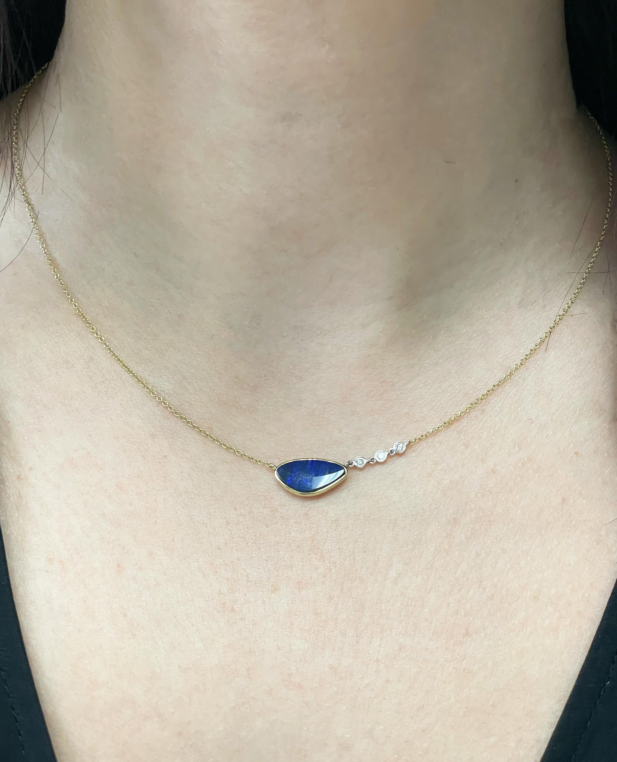 Meira T 14K yellow gold pendant necklace with center blue opal weighing 1.92 carats and diamonds weighing 0.06 carat total. 

- Necklace can be worn 16, 17, or 18 inches. 