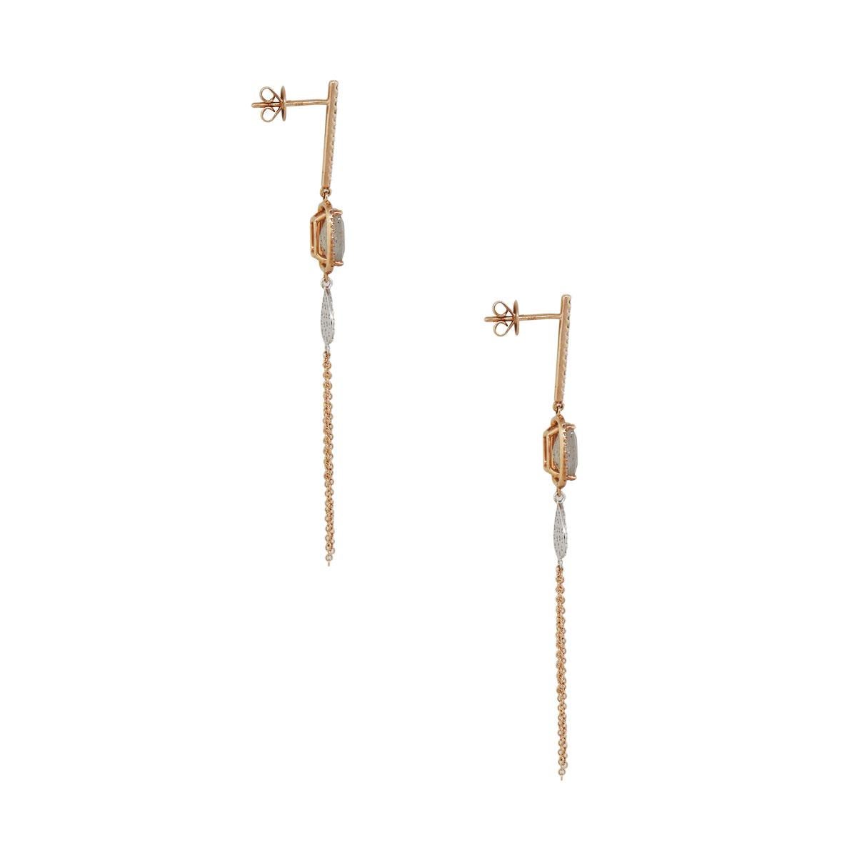 Material: 14k rose gold
Diamond Details: Approximately 0.56ctw of round brilliant diamonds. Diamonds are G/H in color and VS in Clarity
Gemstone Details: Approximately 2.42ctw of labradorite gemstones
Measurements: 2.87″ x 0.18″ x 0.34″
Earring