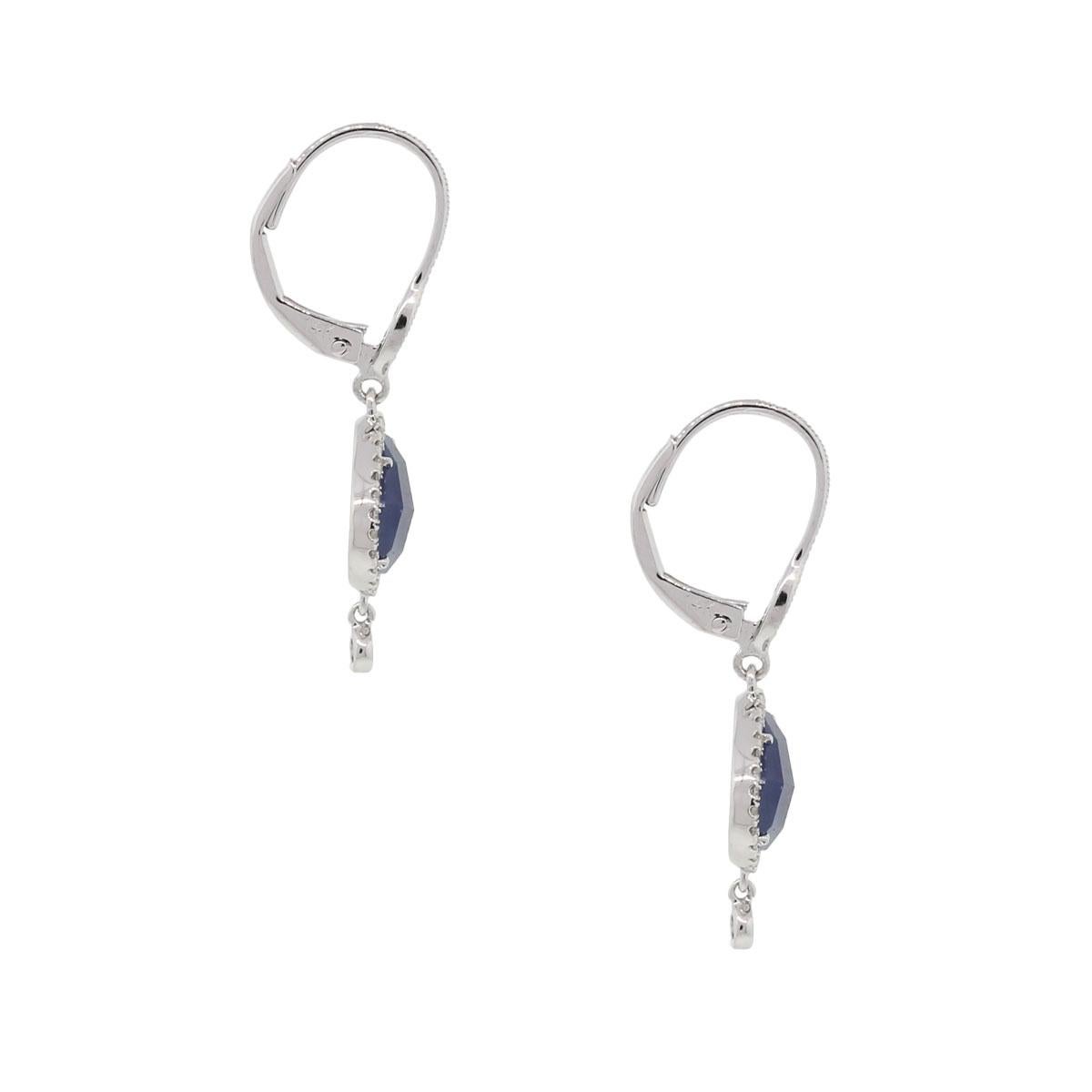 Designer: Meira T
Style: Sapphire and Diamond drop earrings
Material: 14k White Gold
Diamond Details: Approximately 0.26ctw of round brilliant diamonds. Diamonds are G/H in color and SI in clarity
Gemstone Details: Approximately 4.01ctw of