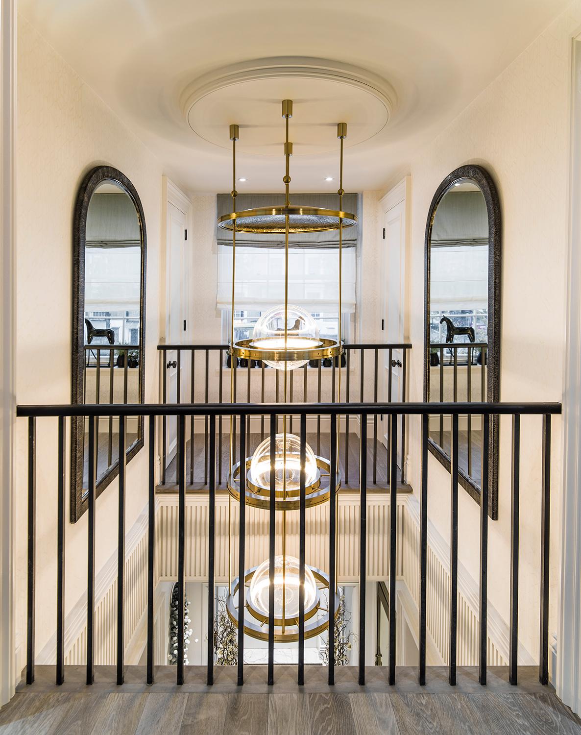 Miessa is a contemporary chandelier with the presence to be a centrepiece in any generous, high-ceilinged space, including atriums and stairwells. Light is refracted in the hidden depths of the solid glass spheres and casts a silky sheen in a