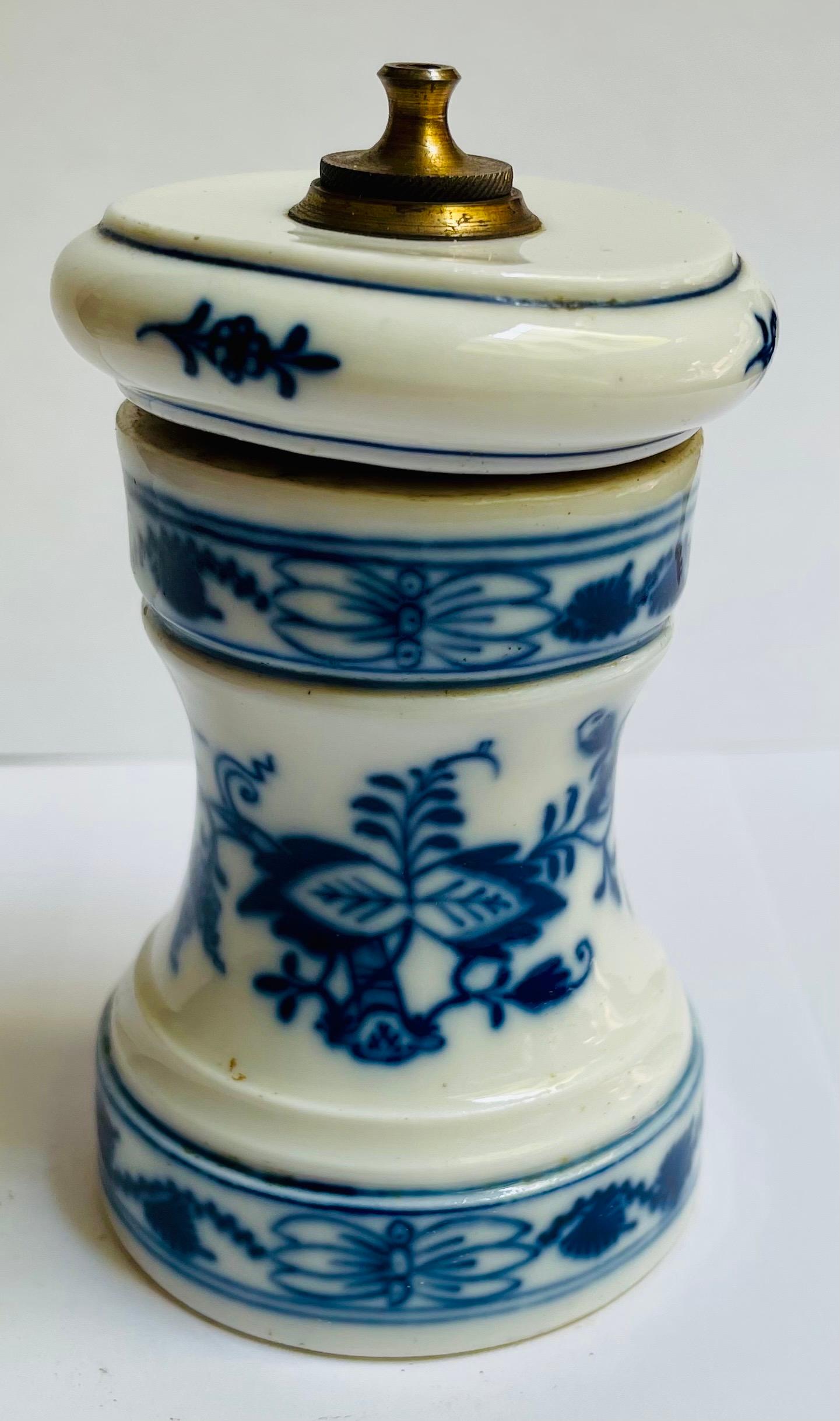 This pepper mill or grinder is a hard to find piece of Meissen Blue Onion pattern porcelain so it might be one you or someone you know needs to add to a collection. It still grinds pepper or spices so you can use it at your next elegant affaire or