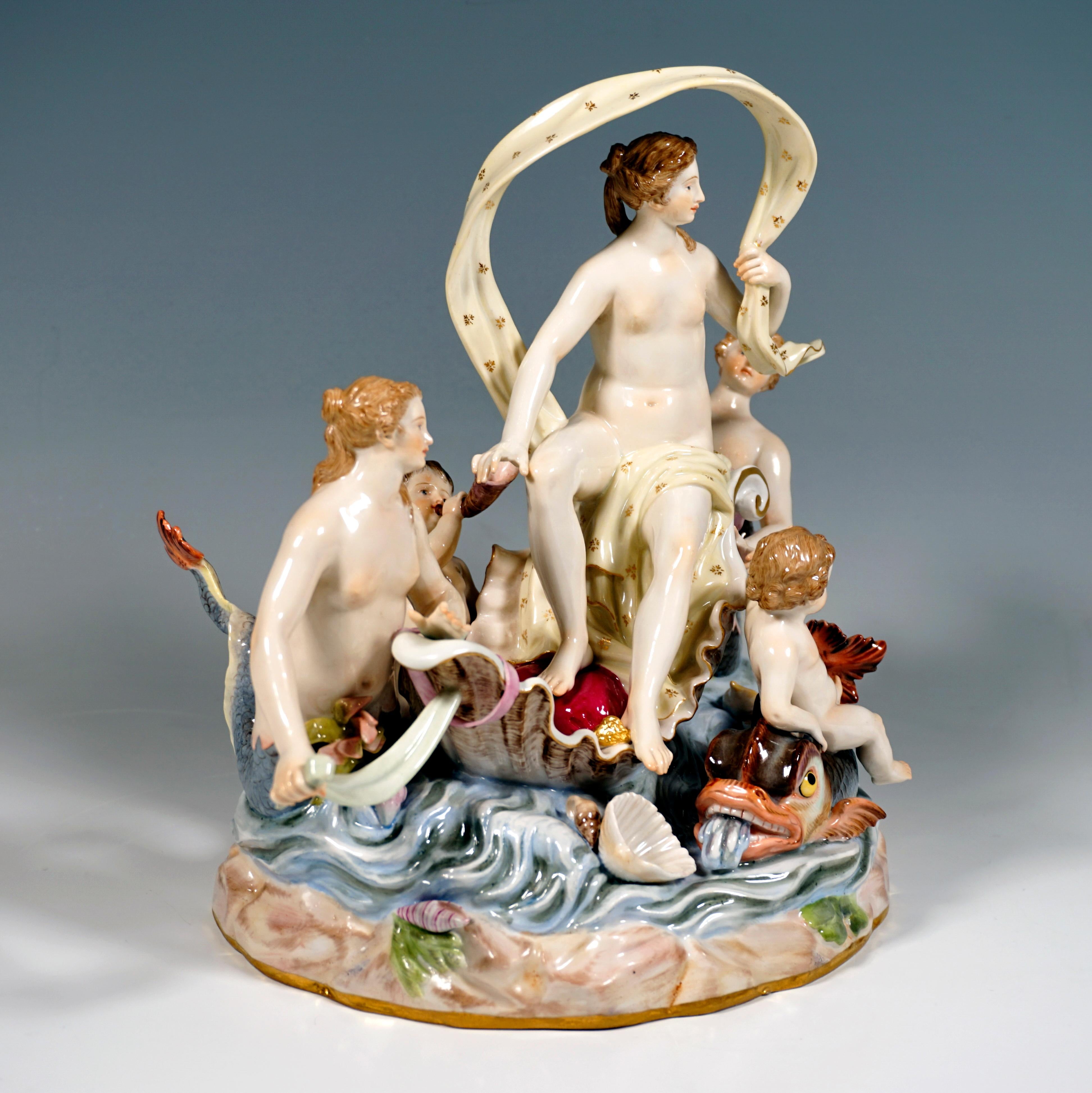 Very rare and delicate Meissen porcelain group of the 19th century:
The nymph, covered only with a cloth, sits on a half shell floating on the water, holding the cloth at one end so that it forms a wavy loop over her body. She is accompanied by