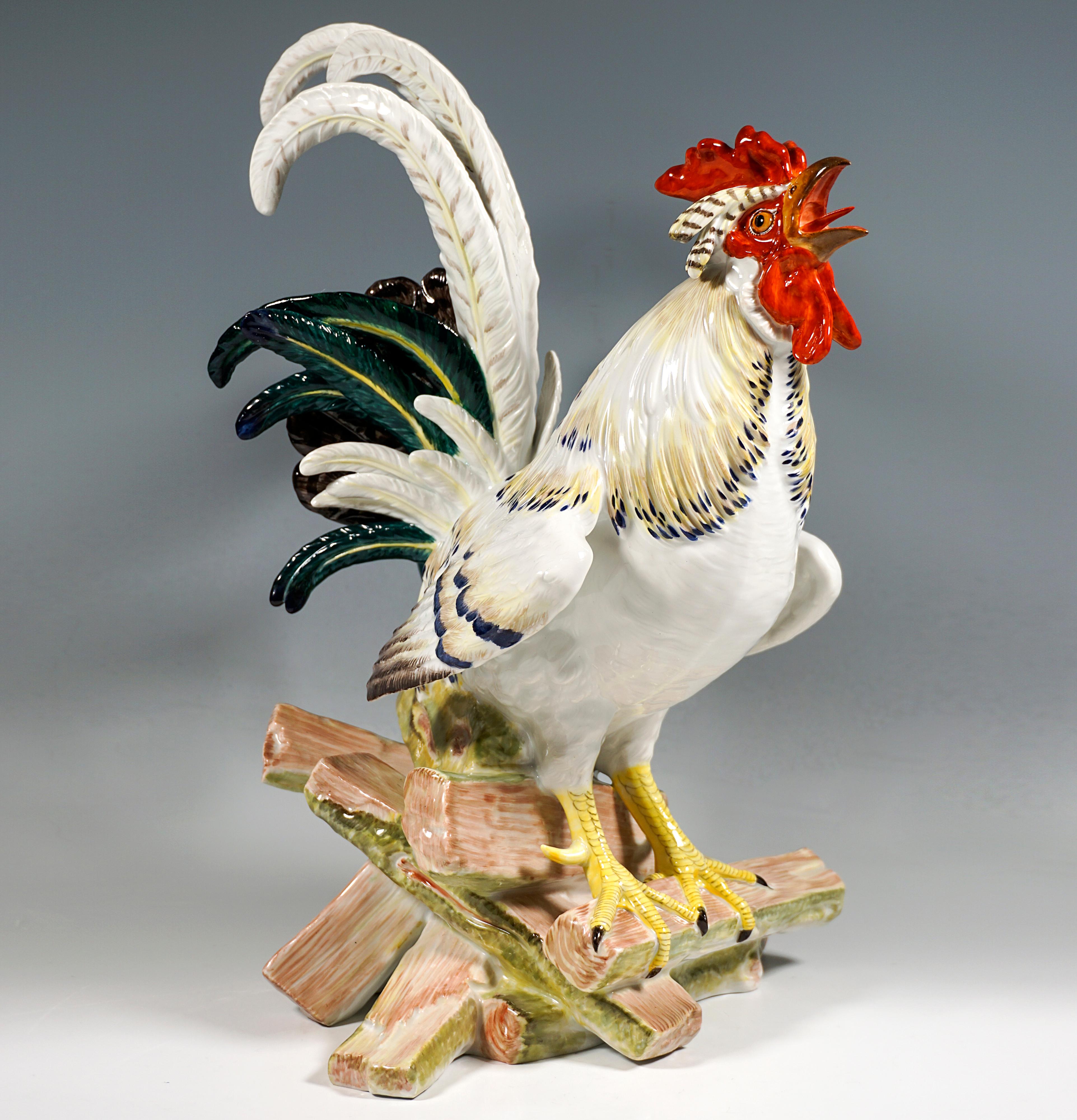 A life-size rooster crowing and sitting on a pile of wood in an extremely naturalistic depiction. Impressive due to its rich sculptural details and flawless, hand-painted staffage, the model is still part of Meissen's exclusive collection