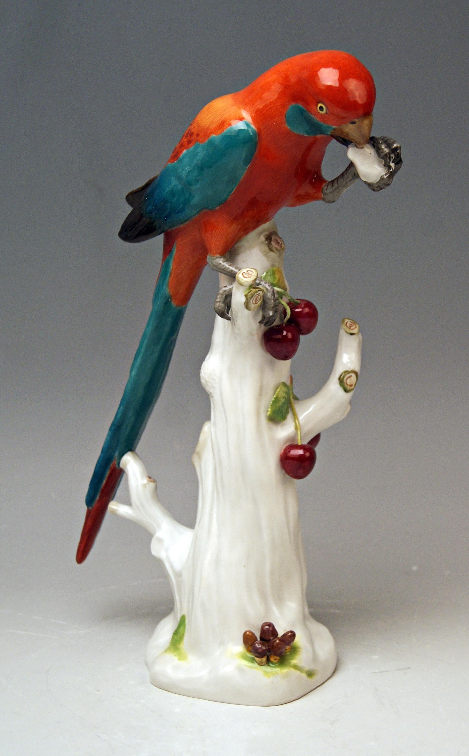 Animal figurine: Parrot situated on a tree's stump with cherries

Manufactory: Meissen
Hallmarked: Blue Meissen sword mark with pommels on hilts (underglazed)
model number 20x / painter's number 72 / former's number 6
First quality
Dating: