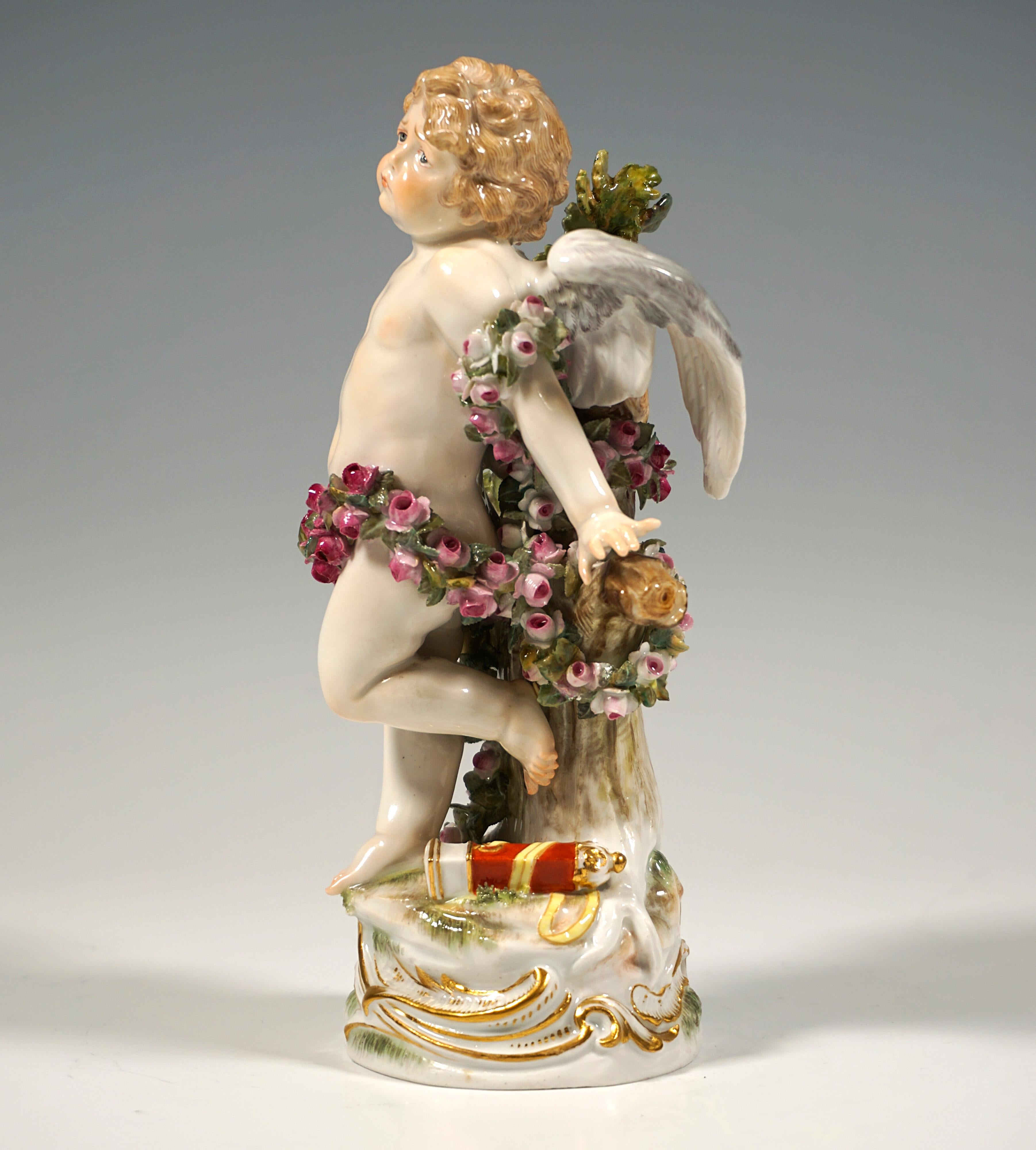 Excellen Art Nouveau porcelain figurine by Paul Helmig:
Winged cupid boy with a suffering expression tied to a tree with a long garland of roses, an empty quiver at his feet.
On high, round natural base with lateral, gold heightened rocaille