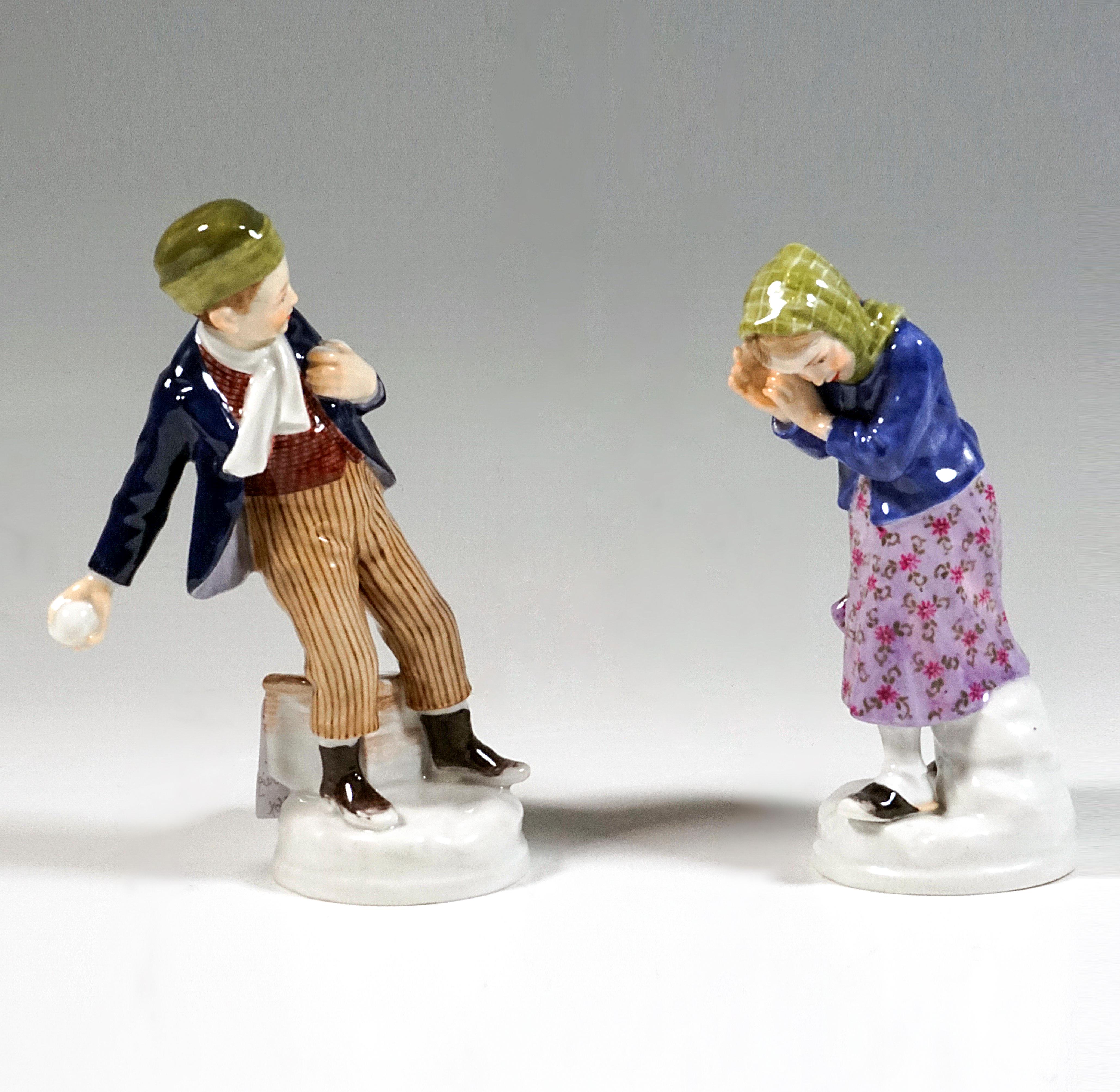 Very charming Meissen Art Nouveau porcelain figurines:
Boy in dark blue jacket, under it a brown vest, striped pants and lace-up shoes, on his head a green cap with a wide brim, a white scarf around his neck, with his right arm reaching far back to