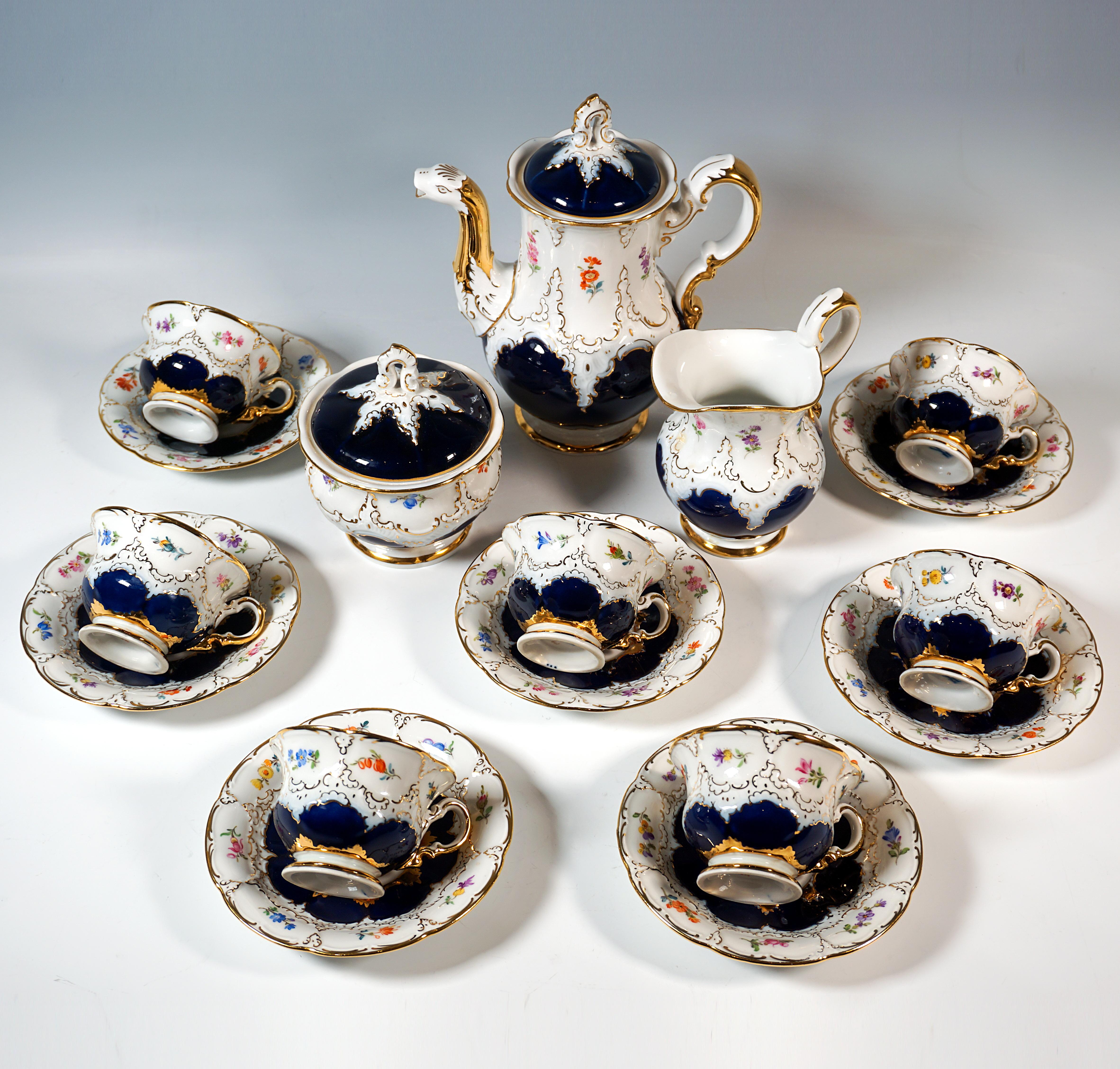 Meissen service, consisting of 22 pieces: 1 coffee pot with lid, 1 milk jug, 1 sugar bowl, 6 cups, 6 saucers, 6 dessert plates and 1 serving platter.
Shape:    B-shape
Decor:    bulbous, curved shape, large cobalt decoration with relief ornaments