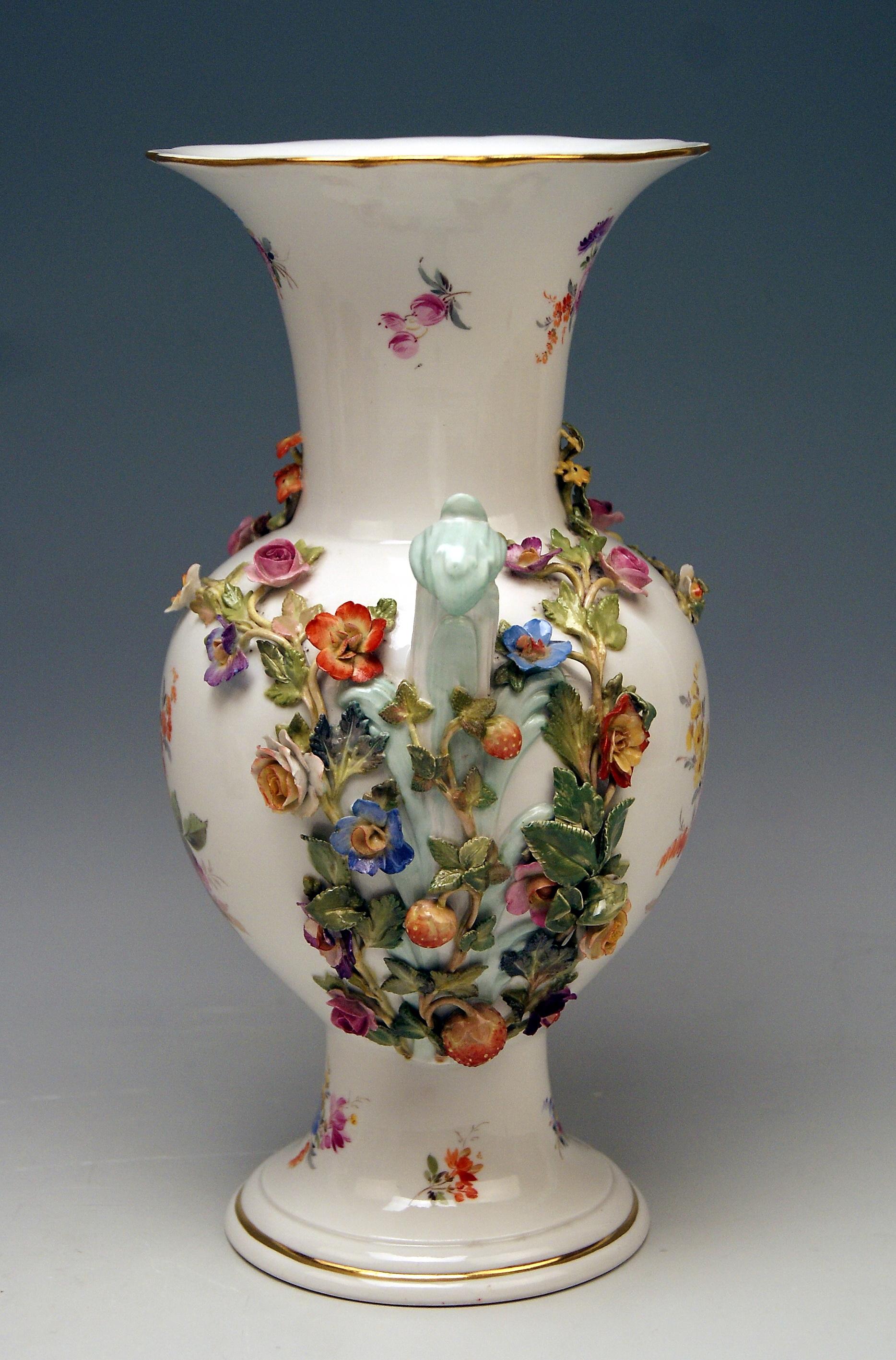 Meissen nicest vase with handles, decorated with sculptured flowers and fruits.

Manufactory: Meissen 
Dating: made circa 1870
Hallmarked: Meissen Mark with Pommels on Hilts (third quarter of 19th century)
First Quality
model number visible,