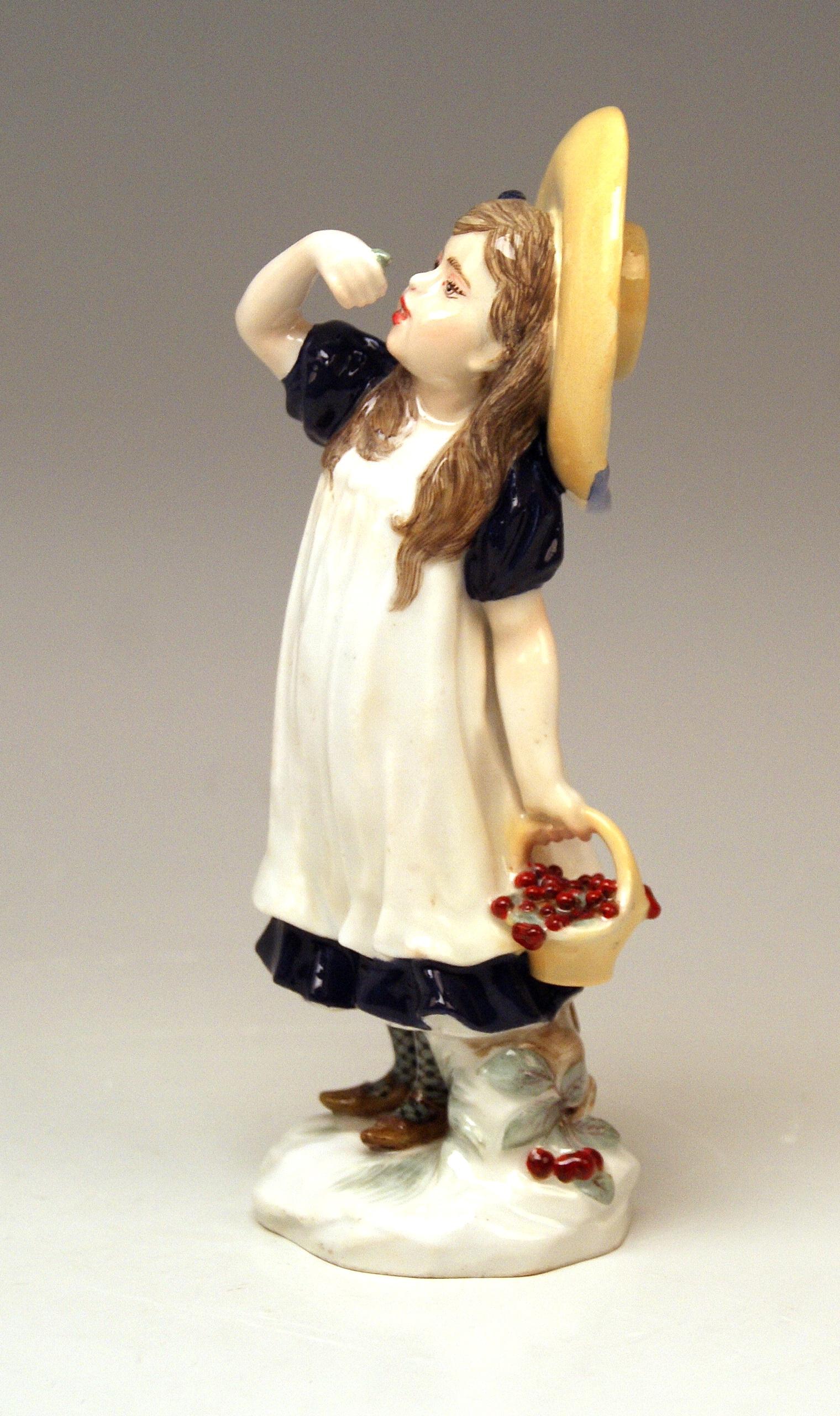 Meissen gorgeous figurine: Lovely child / girl wearing hat eats cherries 

Manufactory: Meissen 
Dating: made circa 1907-1910
Hallmarked: Meissen Mark with Pommels on Hilts (shortly after Turn of the Century)
First quality
model number Y 122 /