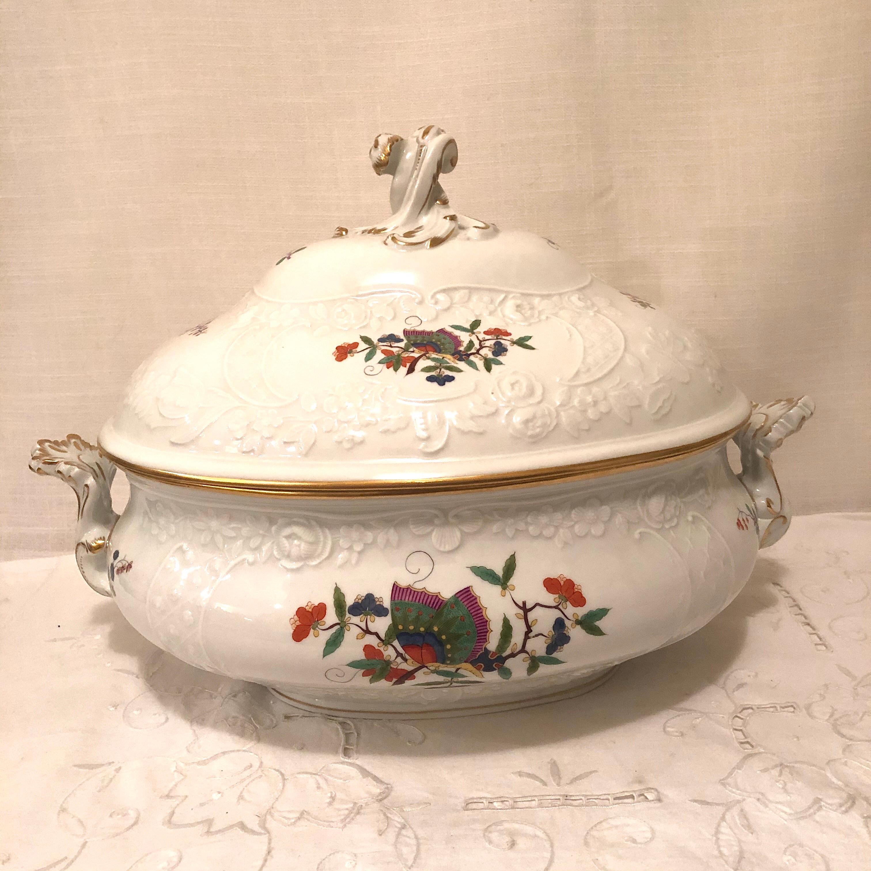I am proud to offer you this rare Meissen Chinese butterfly soup tureen. The tureen is painted in the Kakiemon style with a central Chinese butterfly on a branch, surrounded by flowering branches. The central decoration of the tureen is influenced