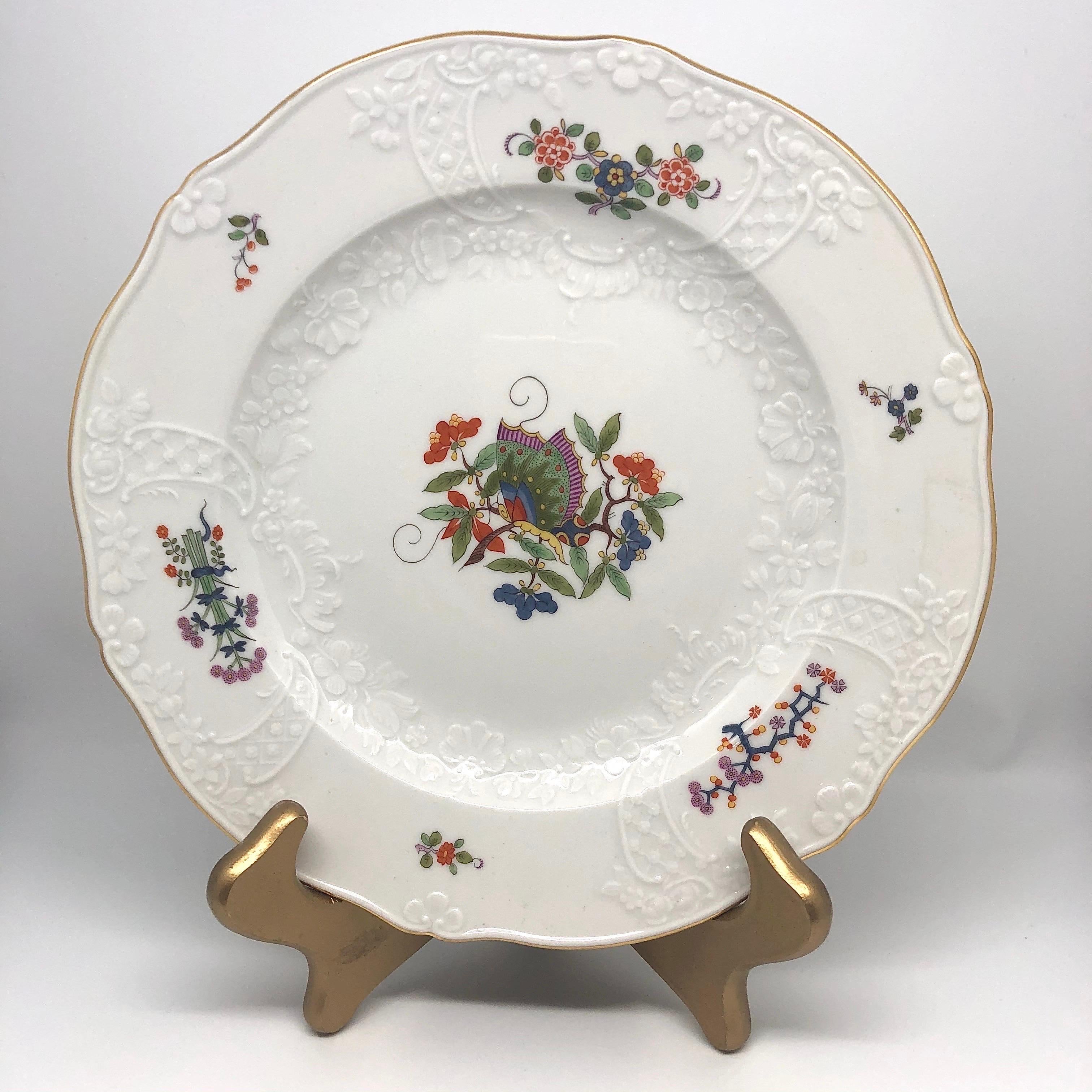I am proud to offer you this famous and rare Meissen Chinese butterfly dinner service. Each piece is painted in the Kakiemon style with a central Chinese butterfly on a branch, surrounded by flowering branches. The central part of the plates is from