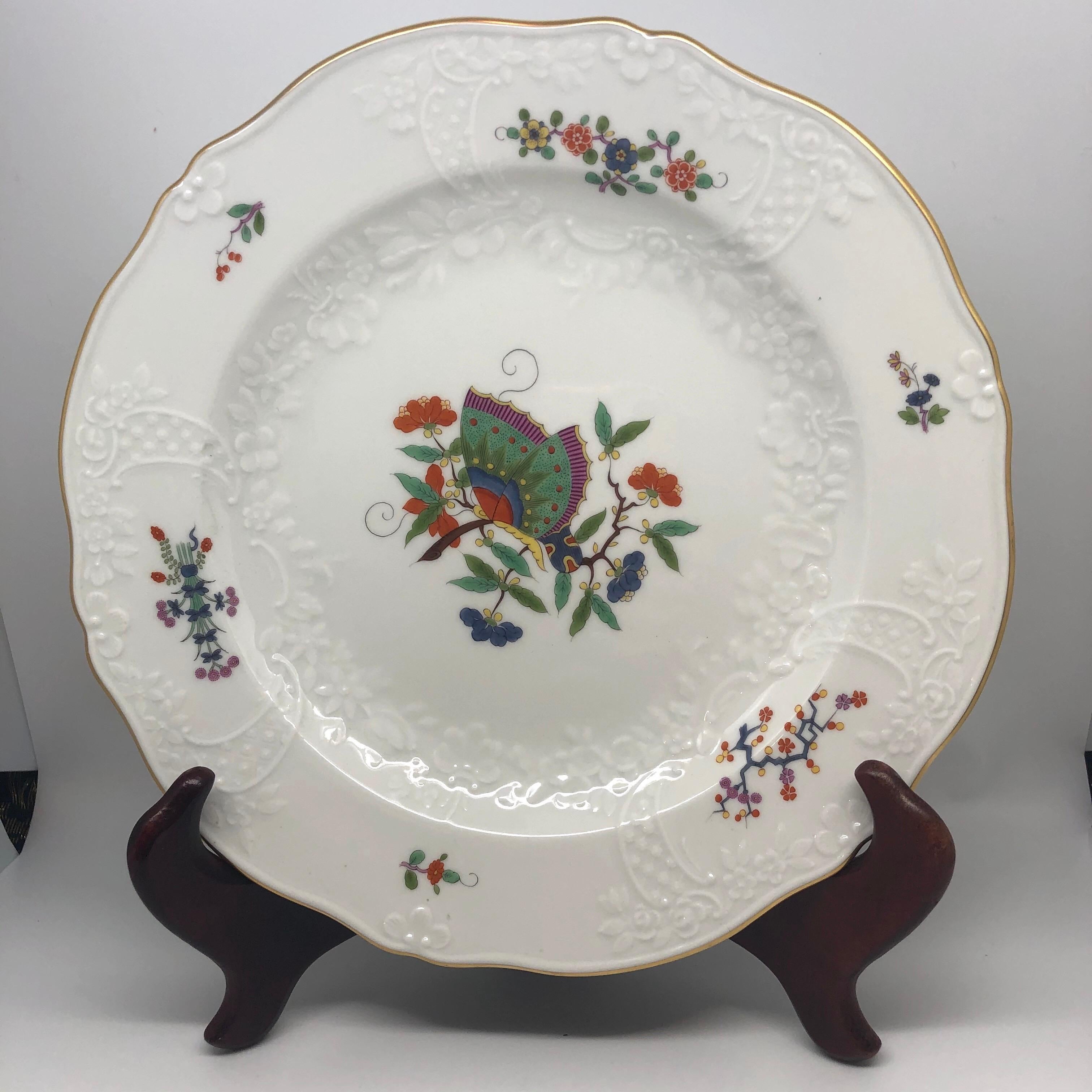 I am proud to offer you this famous and rare Meissen Chinese butterfly dinner service.  Each piece is painted in the Kakiemon style with a central Chinese butterfly on a branch, surrounded by flowering branches. The central part of the plates is