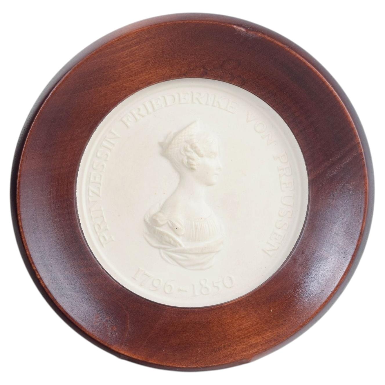 Meissen. Circular relief plaque in biscuit with female profile portrait. 1970s For Sale