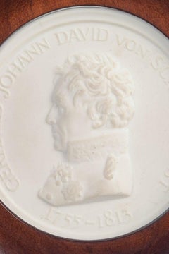 Meissen. Circular relief plaque in biscuit with male profile portrait. 1970s