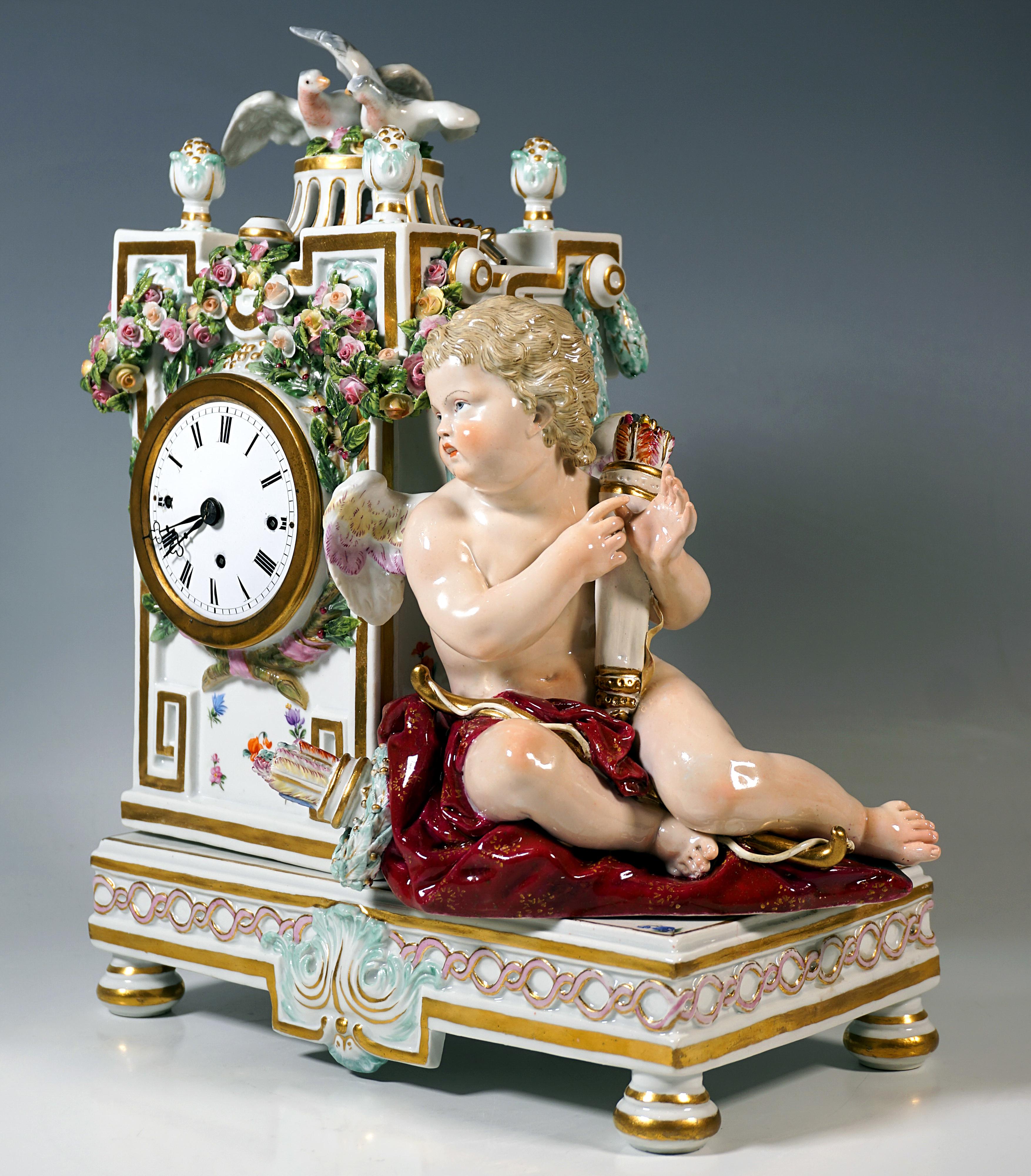 Exceptional 19th Century Porcelain Clock Case:
Rectangular base plate with gold edges and a gold-embossed wave frieze on the sides and rocaille decorations in the centre of the front and back, standing on four lobed feet, on the left side of the