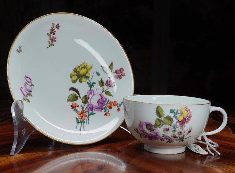Meissen cup and saucer, well painted with ‘deutschBlumen’ flower sprays and specimens, within a gold line rim.
Blue crossed swords mark,
circa 1750.