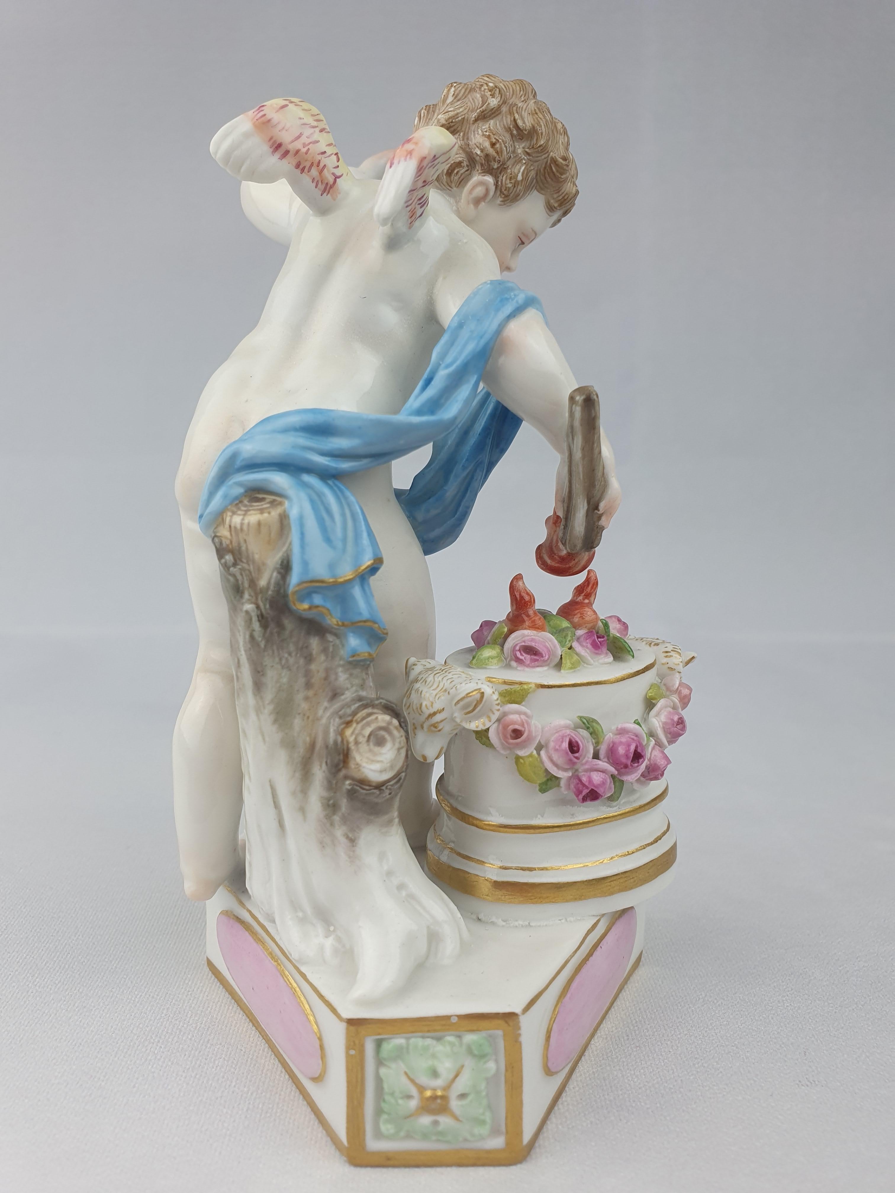 Meissen figure of cupid lighting hearts with flame from a series of 16 each inscribed with the motto in french on the base. In this instance it says ‘Je Les Enflamme’ ‘I Ignite them’. All 16 cupids were origionally modelled by Acier between 1775