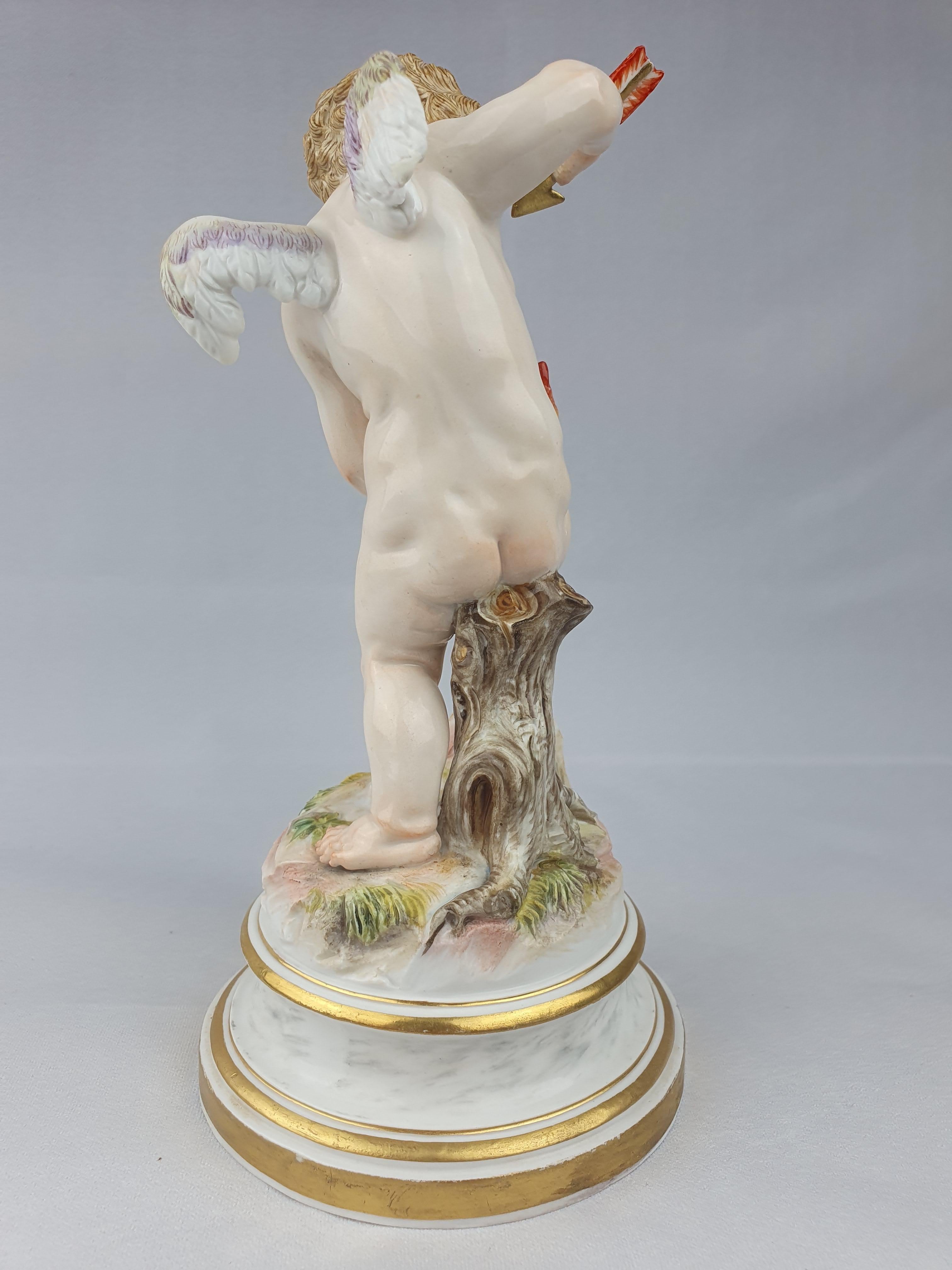Meissen Figure of cupid stabbing heart with arrow from a series of 27 cupids first modelled by Heinrich Schwabe 1878. Circa 1890

Model L10 & Painters mark 40

Cross swords in underglaze blue.