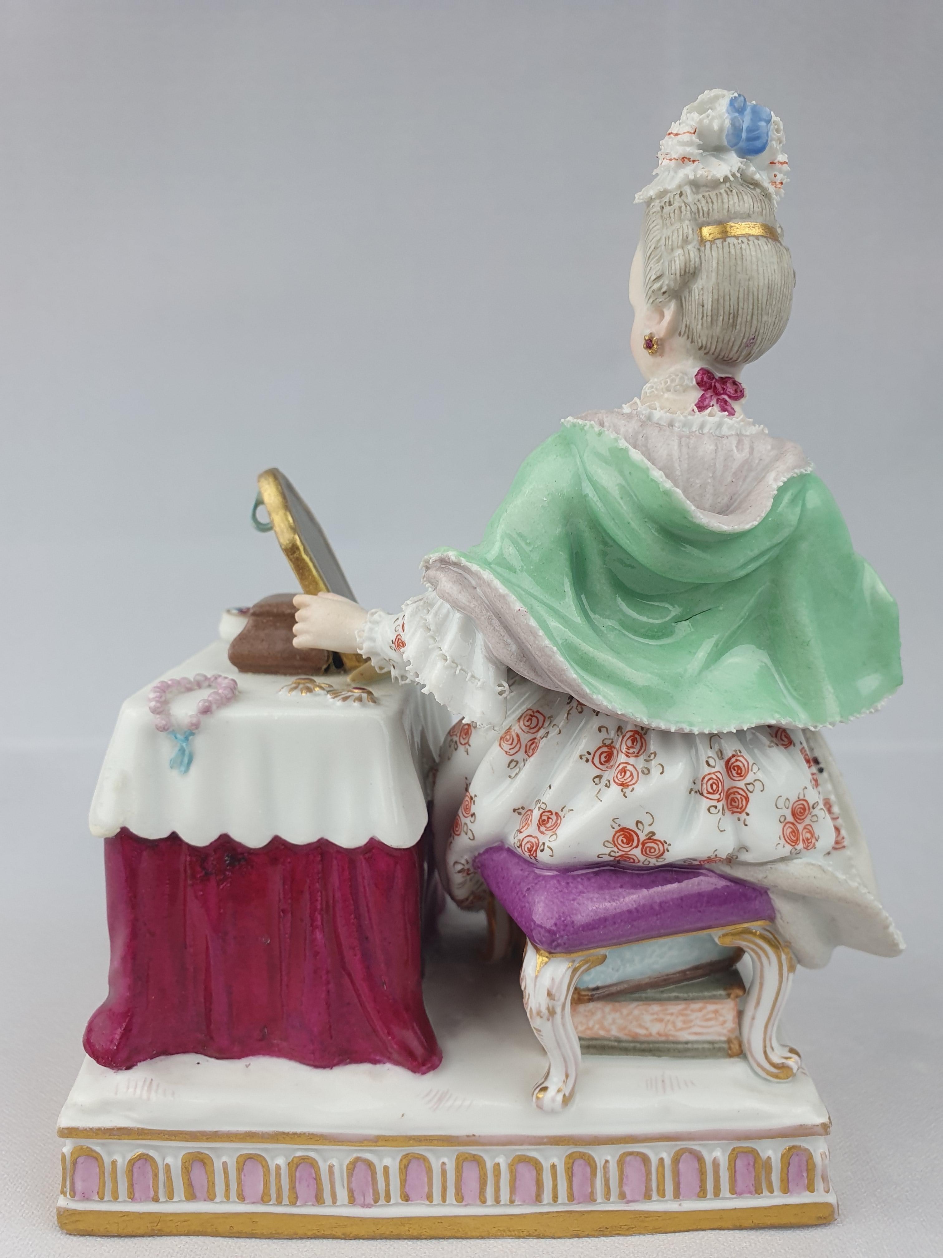 Meissen Figure of Sense of Sight from the series of the five senses. Model number E3.

First modelled by J.C Schoenhelt in 1772.

Height is 14cm.

Underglaze blue crossed swords on underside of base.

circa 1860.