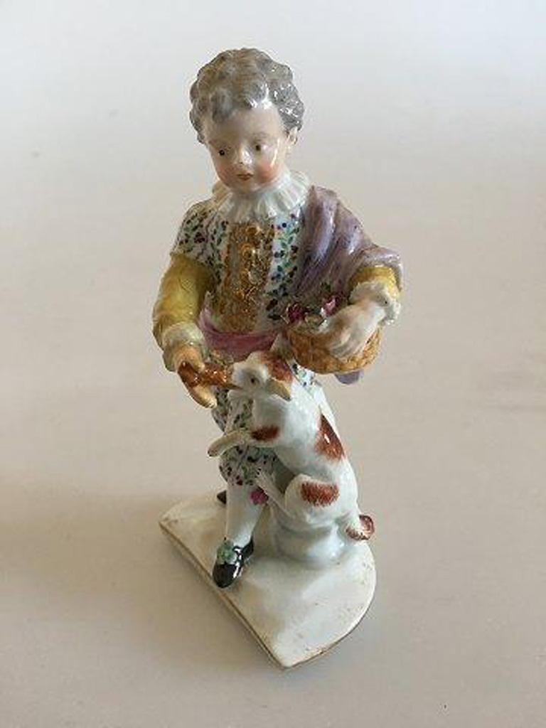 Meissen figurine boy with dog. 

Measures 11,3cm. Boys arm and dogs legs has a repair.
 