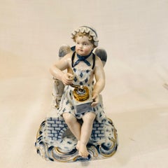 Meissen Figurine of a Boy Angel with Wings Grounding Coffee for His Coffee Pot