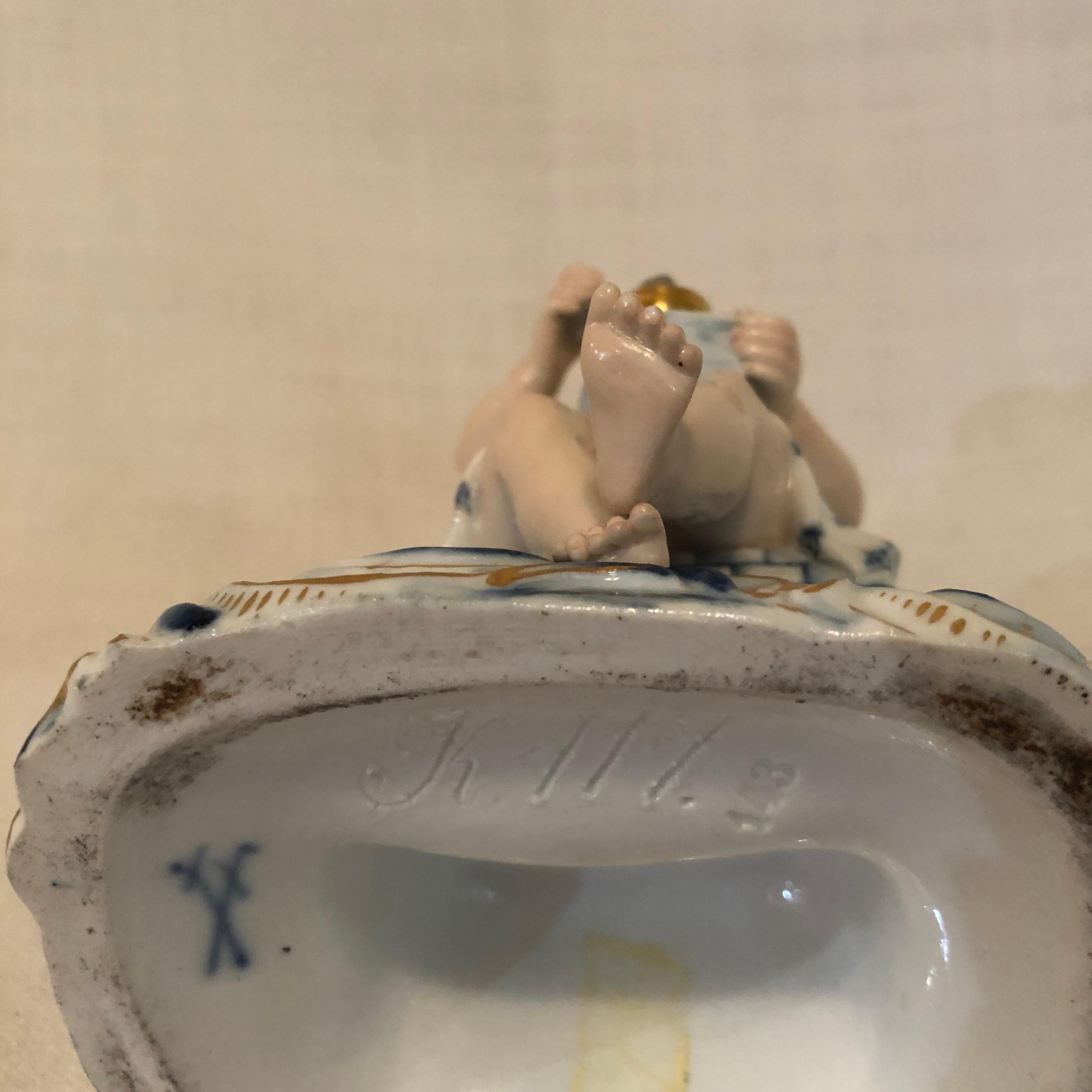 Late 19th Century Meissen Figurine of a Boy Angel with Wings Grounding Coffee for His Coffee Pot